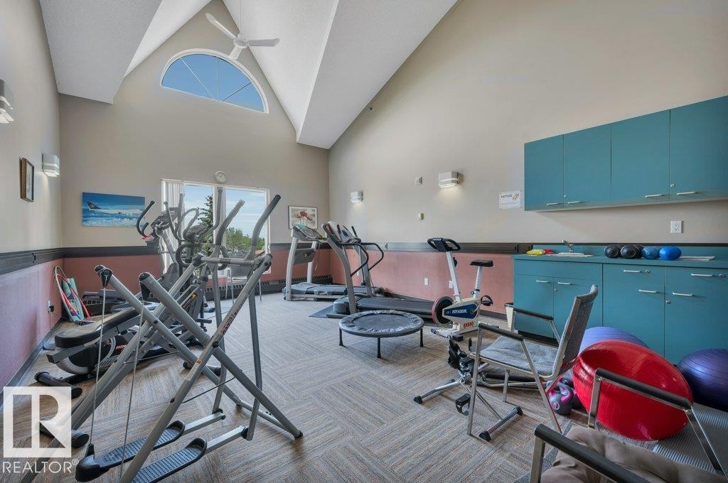 Vaulted ceiling with an arched window and ceiling fan - 316 2011 137 Avenue, Edmonton, AB - Indoor Photo Showing Gym Room