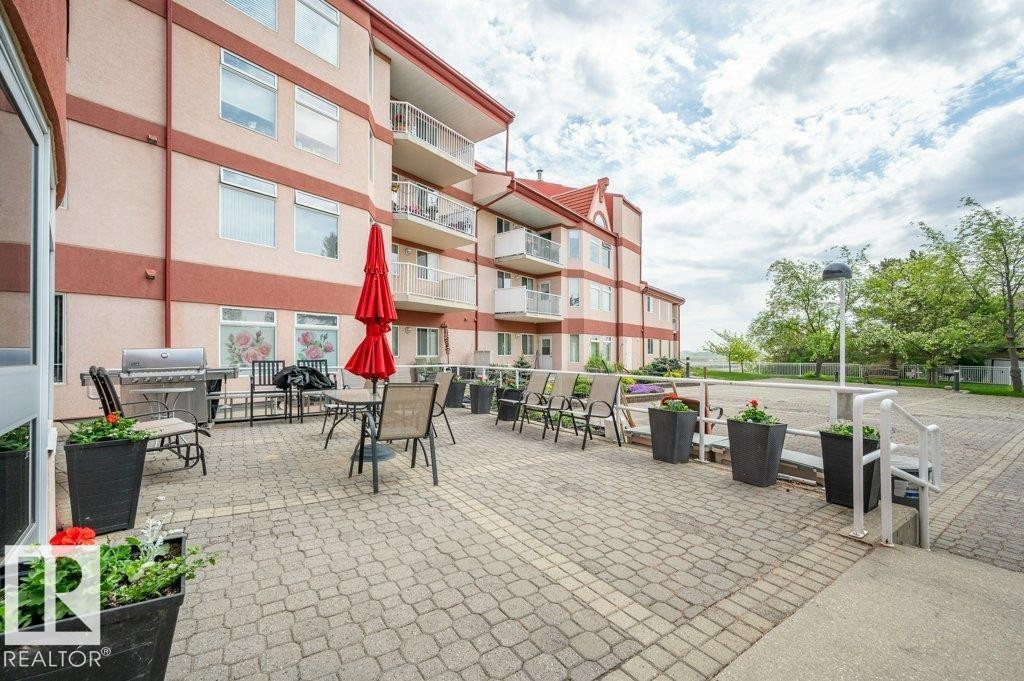 Expansive paver patio offering an outdoor living area - 316 2011 137 Avenue, Edmonton, AB - Outdoor With Balcony With Exterior