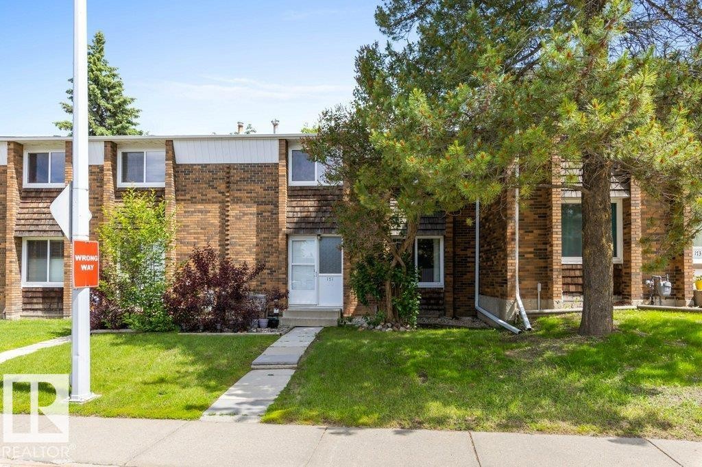 Brick and wood-shingle exterior with white trim - 171 Ridgewood, St. Albert, AB
