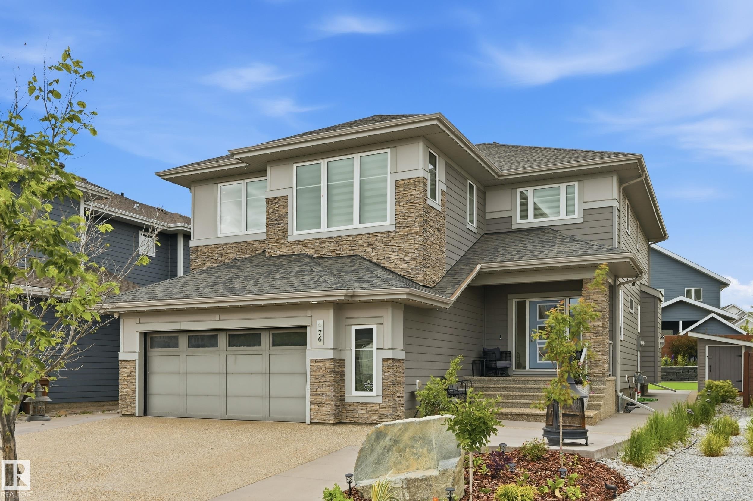 Contemporary two-story residence featuring a combination of siding and stone veneer - 76 Jacobs Close, St. Albert, AB