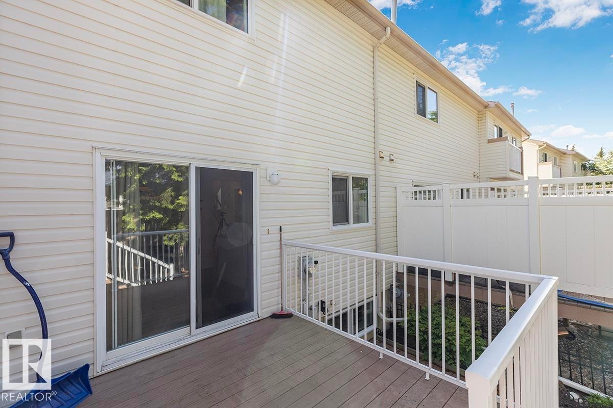 Outdoor deck featuring composite flooring and white railing - 44 9630 176 Street, Edmonton, AB