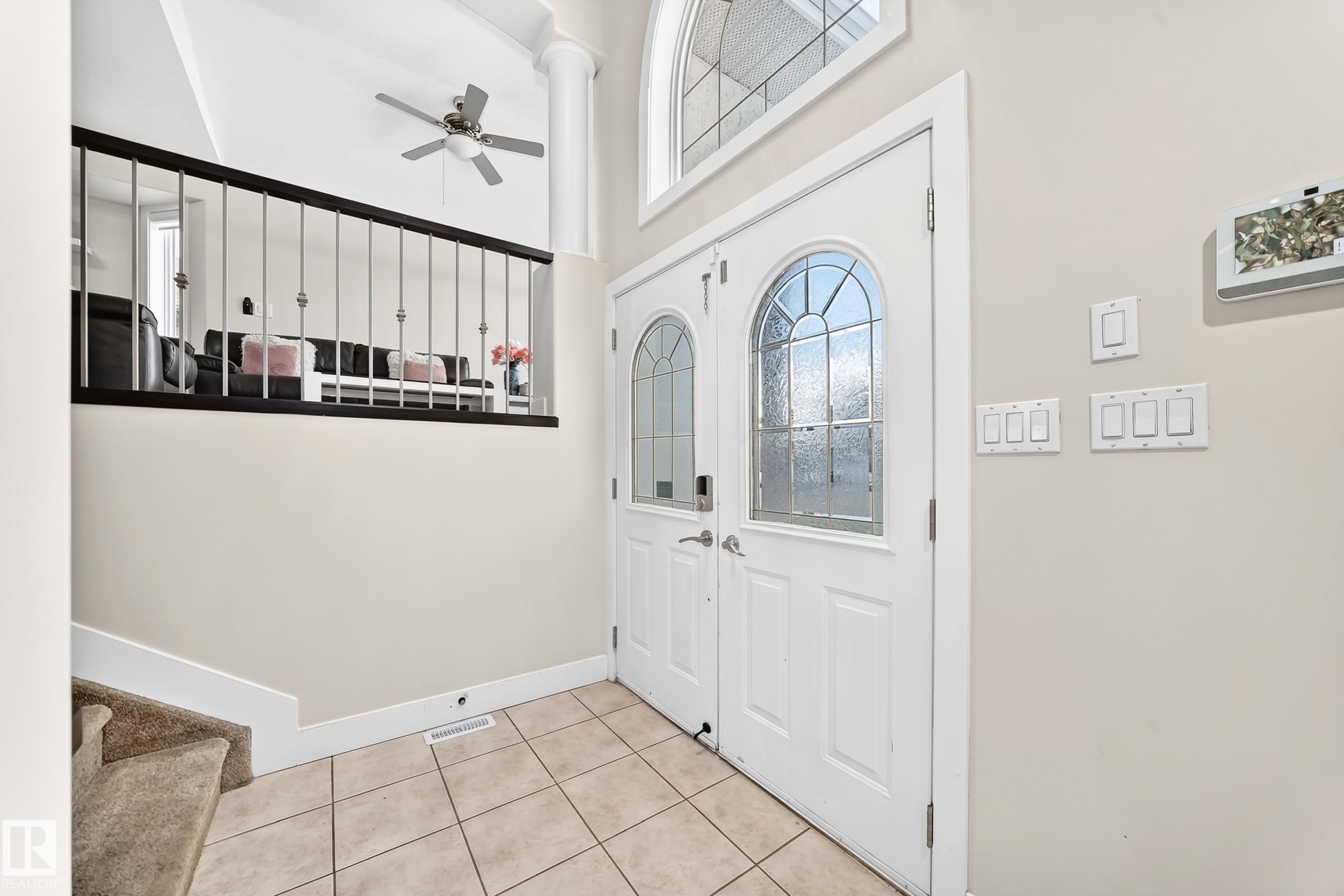 Double entry doors with arched decorative glass panels - 16124 76 Street, Edmonton, AB