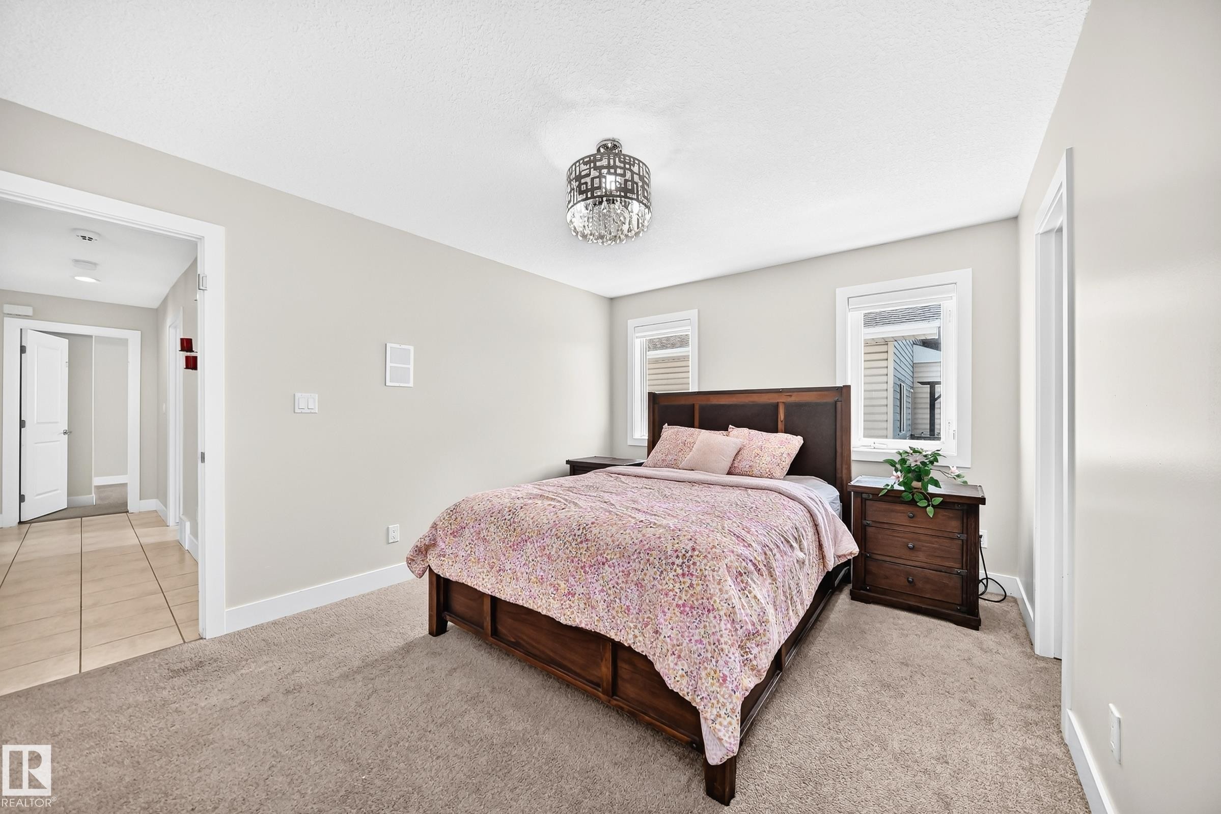 Bedroom with neutral wall color and carpeted flooring - 16124 76 Street, Edmonton, AB
