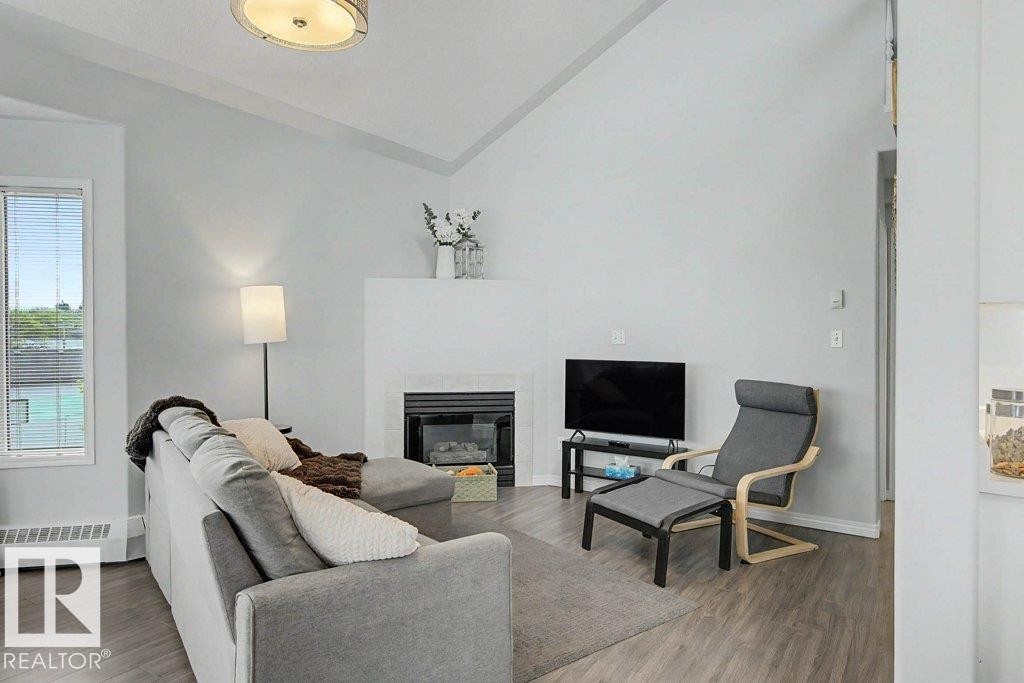 401 10827 85 Avenue, Edmonton, AB - Indoor Photo Showing Living Room With Fireplace