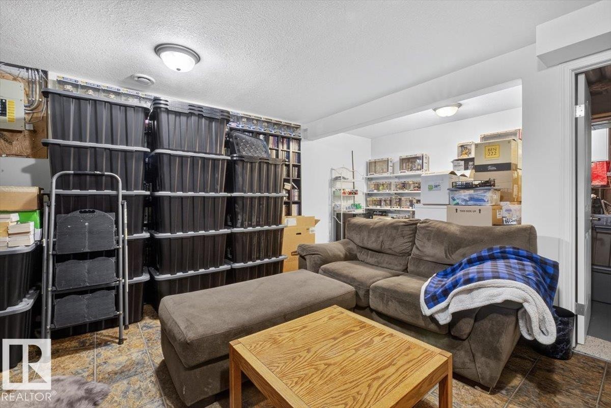 Lower level room featuring tiled flooring and recessed lighting - 27 Walden Park, St. Albert, AB