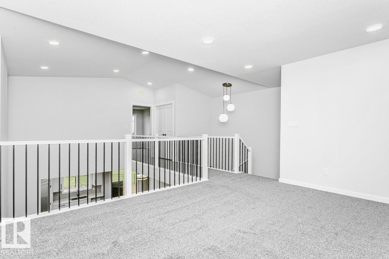 Bonus room. Virtually staged for illustration purposes. Furniture and decor not included. - 2940 65 Street, Edmonton, AB