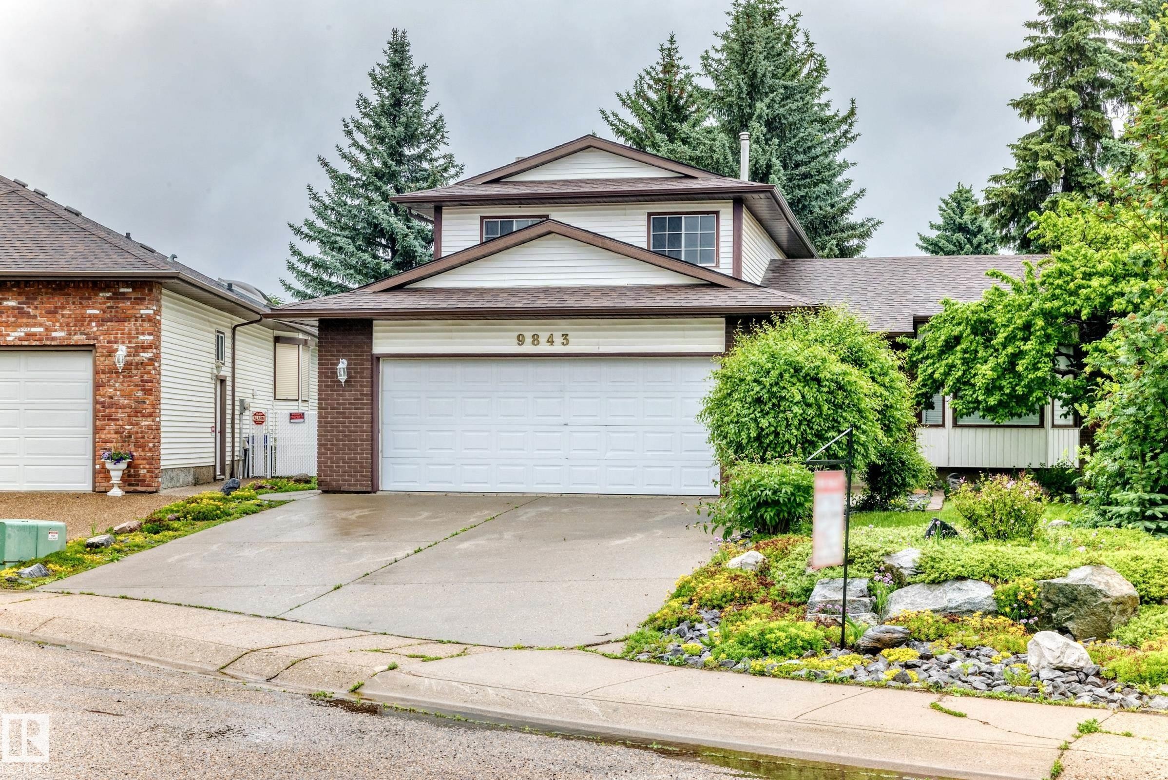 Two-story residence featuring white siding and brown trim - 9843 188 Street, Edmonton, AB