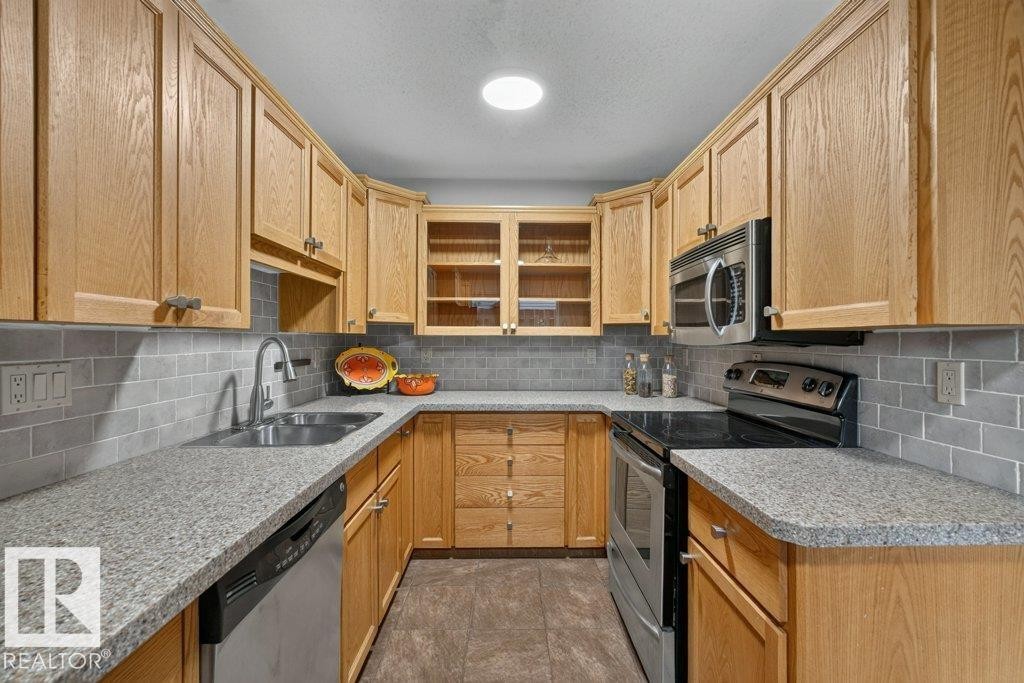 #3 10160 119 St Nw, Edmonton, AB - Indoor Photo Showing Kitchen With Double Sink
