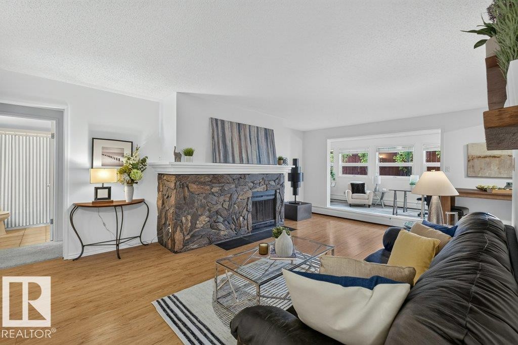 #3 10160 119 St Nw, Edmonton, AB - Indoor Photo Showing Living Room With Fireplace