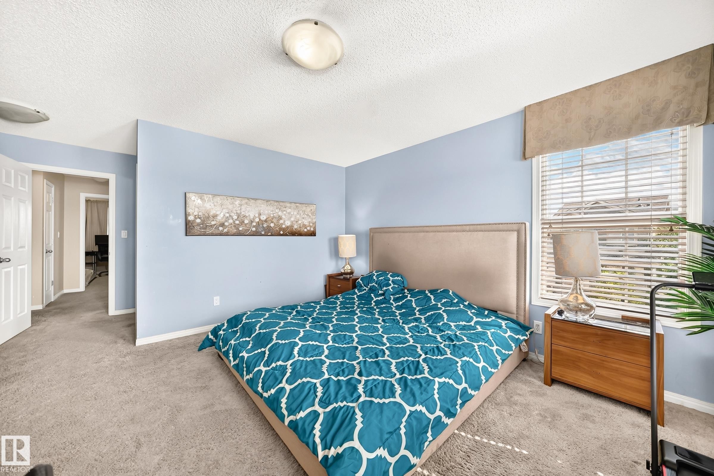 Carpeted bedroom with light blue walls and white trim - 875 Chappelle Link Link Sw, Edmonton, AB