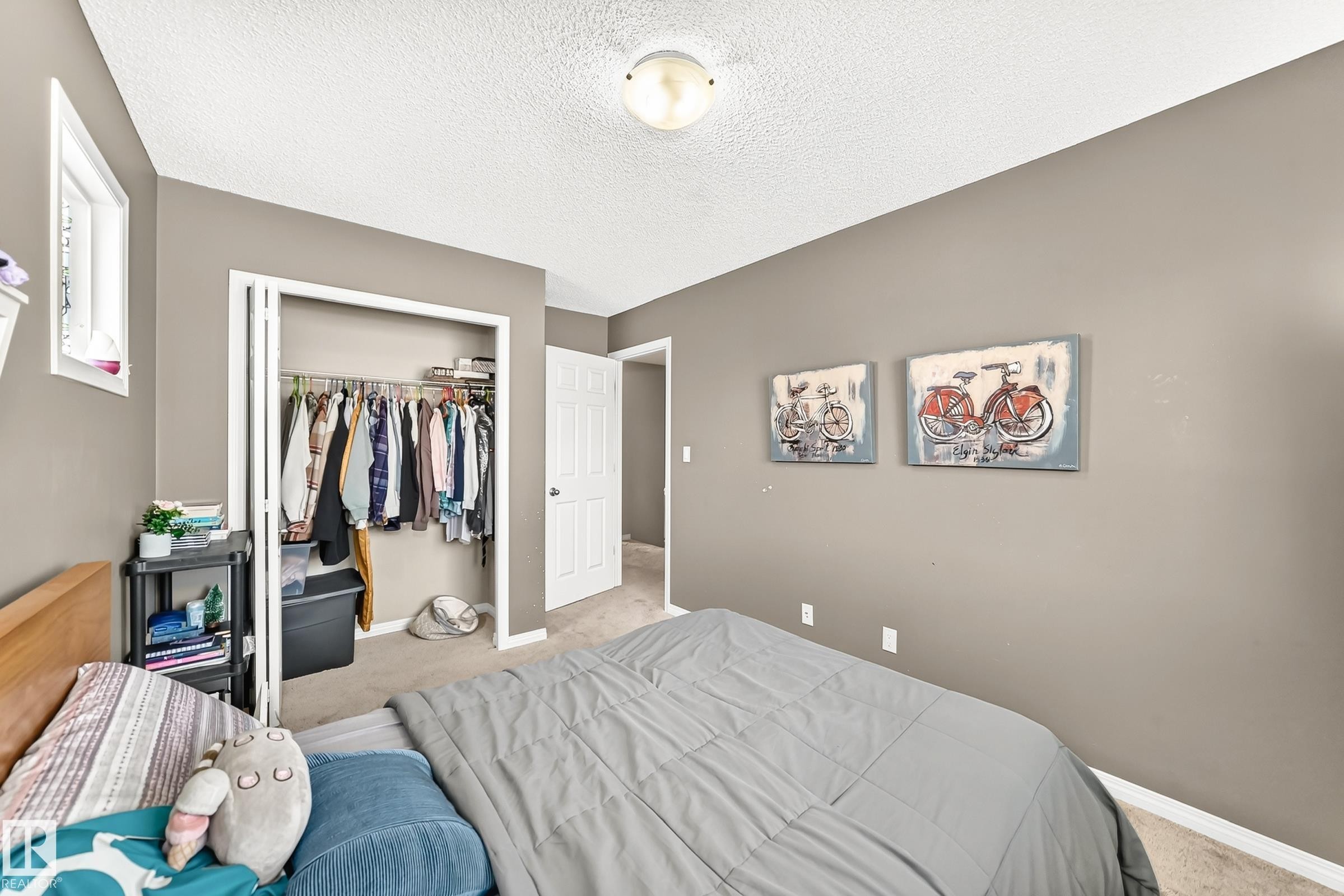 Bedroom featuring neutral wall paint, white trim, and a window for natural light - 875 Chappelle Link Link Sw, Edmonton, AB