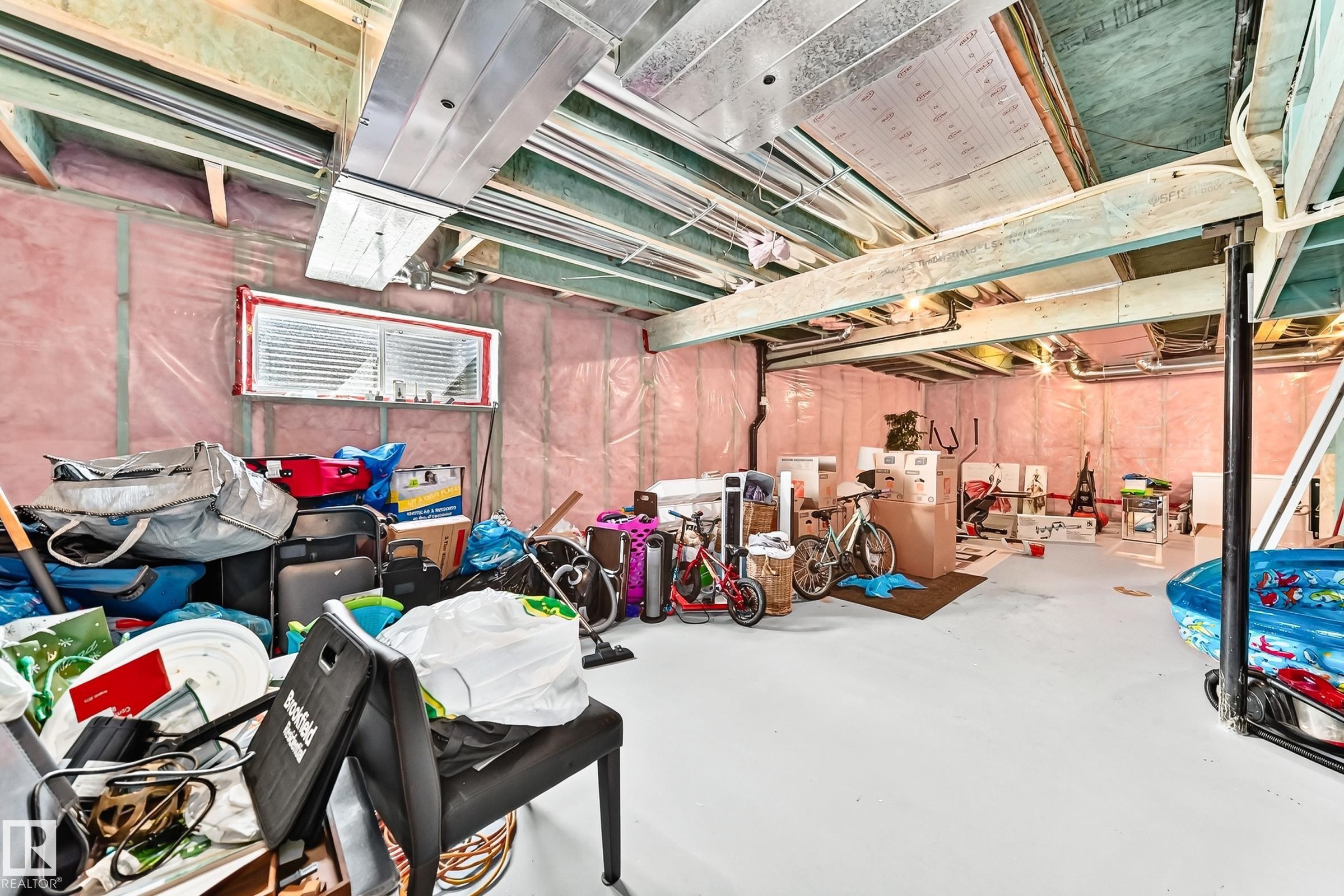 Unfinished basement offering expansive open space, exposed ceiling joists, and visible insulation - 875 Chappelle Link Link Sw, Edmonton, AB