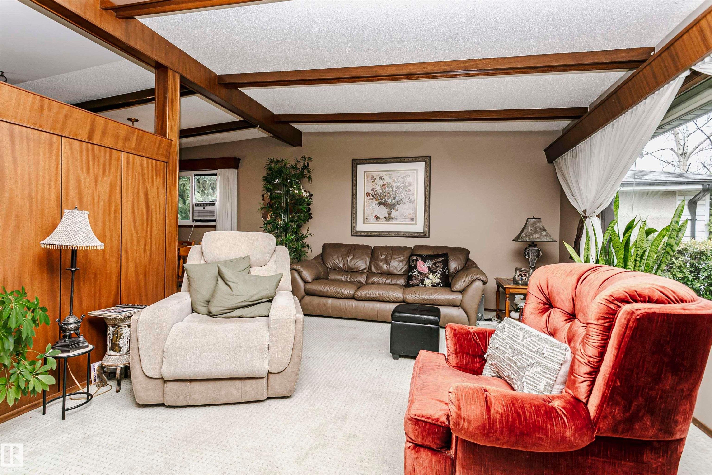 Wood-paneled accent wall with exposed ceiling beams and recessed lighting - 14231 80 Street, Edmonton, AB