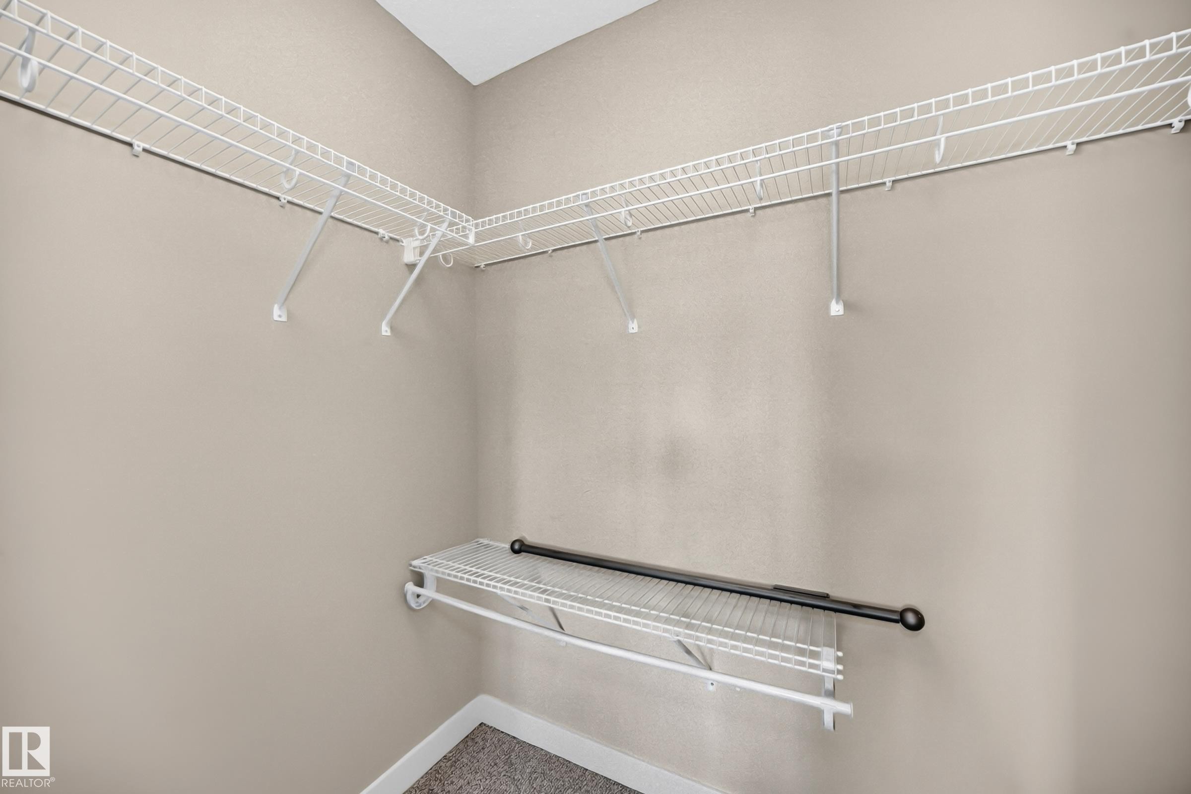 Interior closet featuring wire shelving and a garment rod - 2433 Glenridding Boulevard, Edmonton, AB