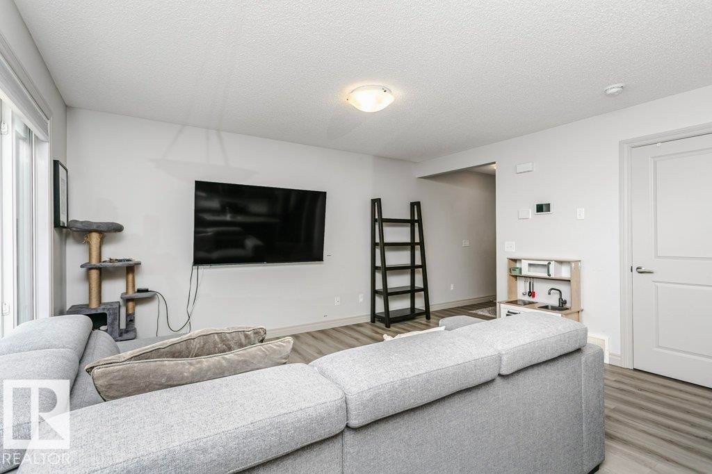 30 445 Brintnell Boulevard, Edmonton, AB - Indoor Photo Showing Living Room