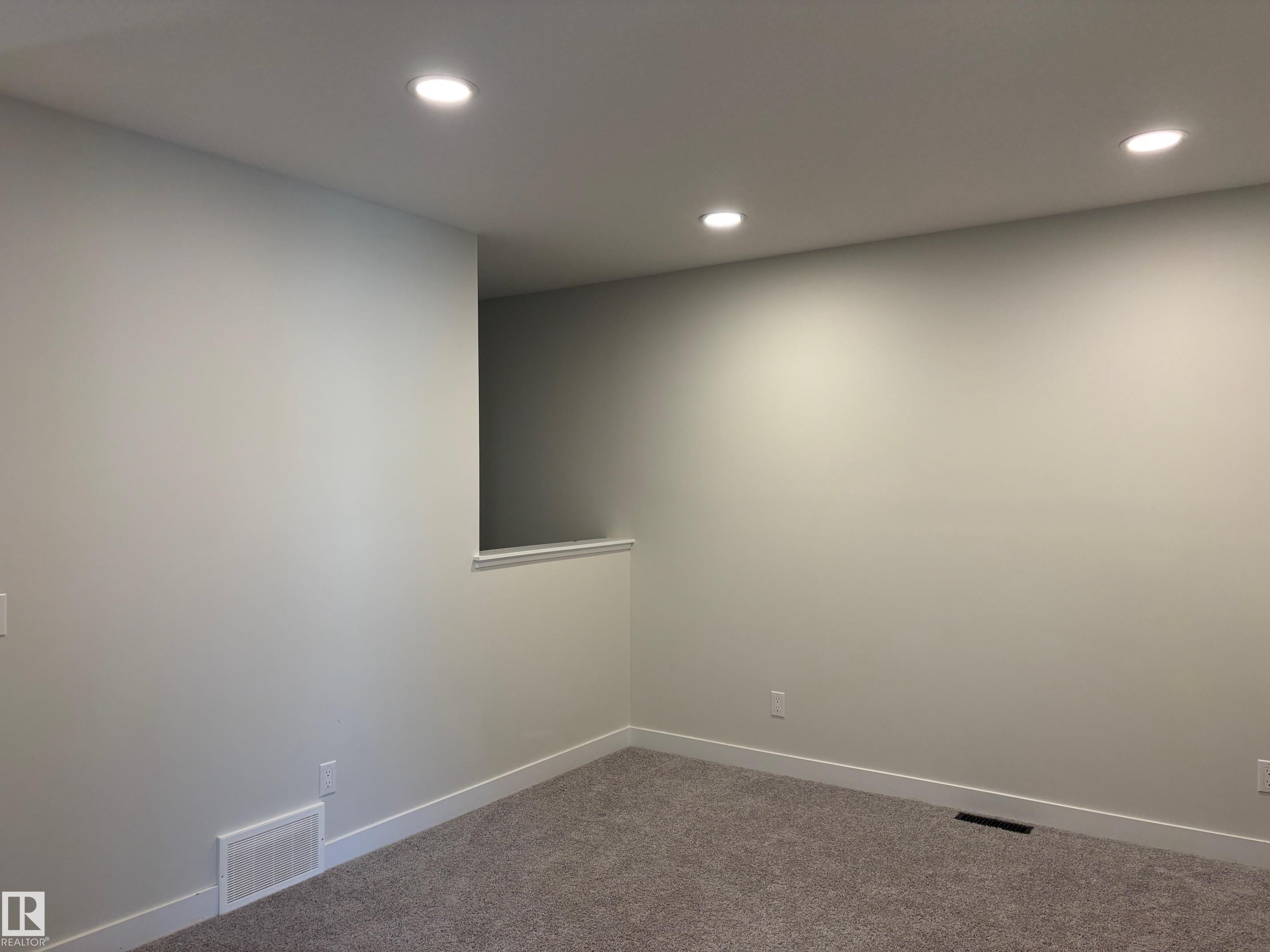 Neutral tone walls with recessed lighting and gray carpet flooring - 9952 227 Street, Edmonton, AB