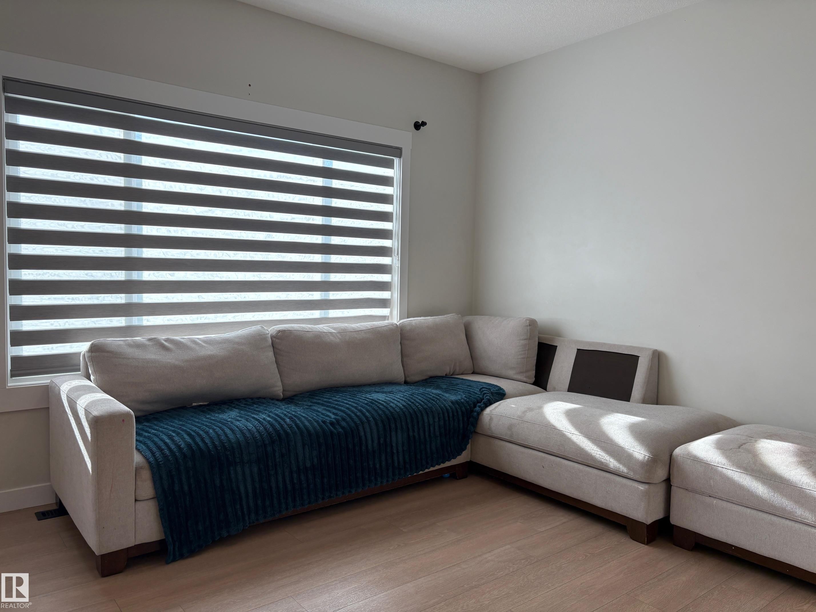 Corner window featuring zebra blinds - 9952 227 Street, Edmonton, AB