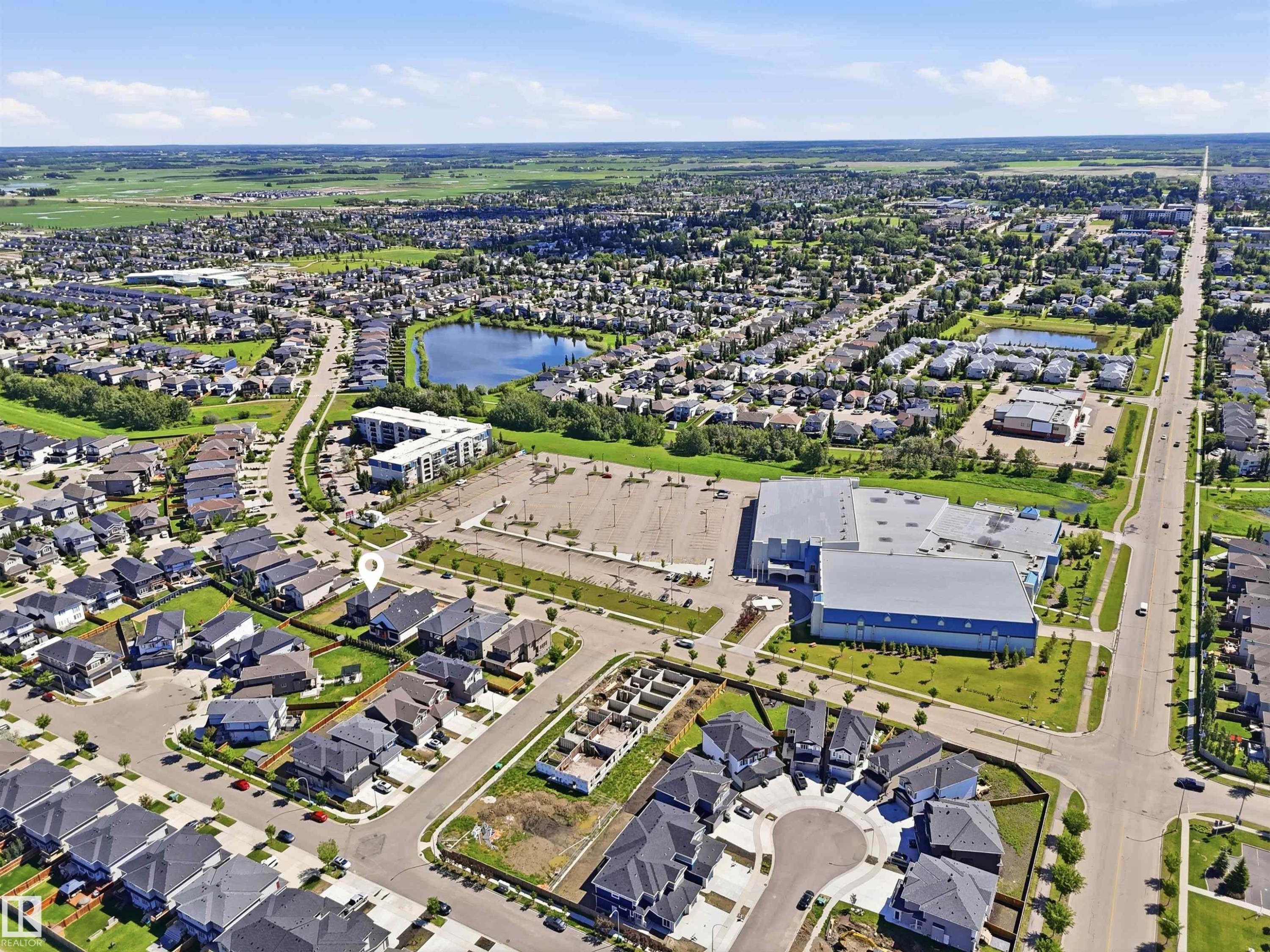 Expansive aerial rendering a residential neighborhood with varied housing styles - 5110 Rue Eaglemont, Beaumont, AB