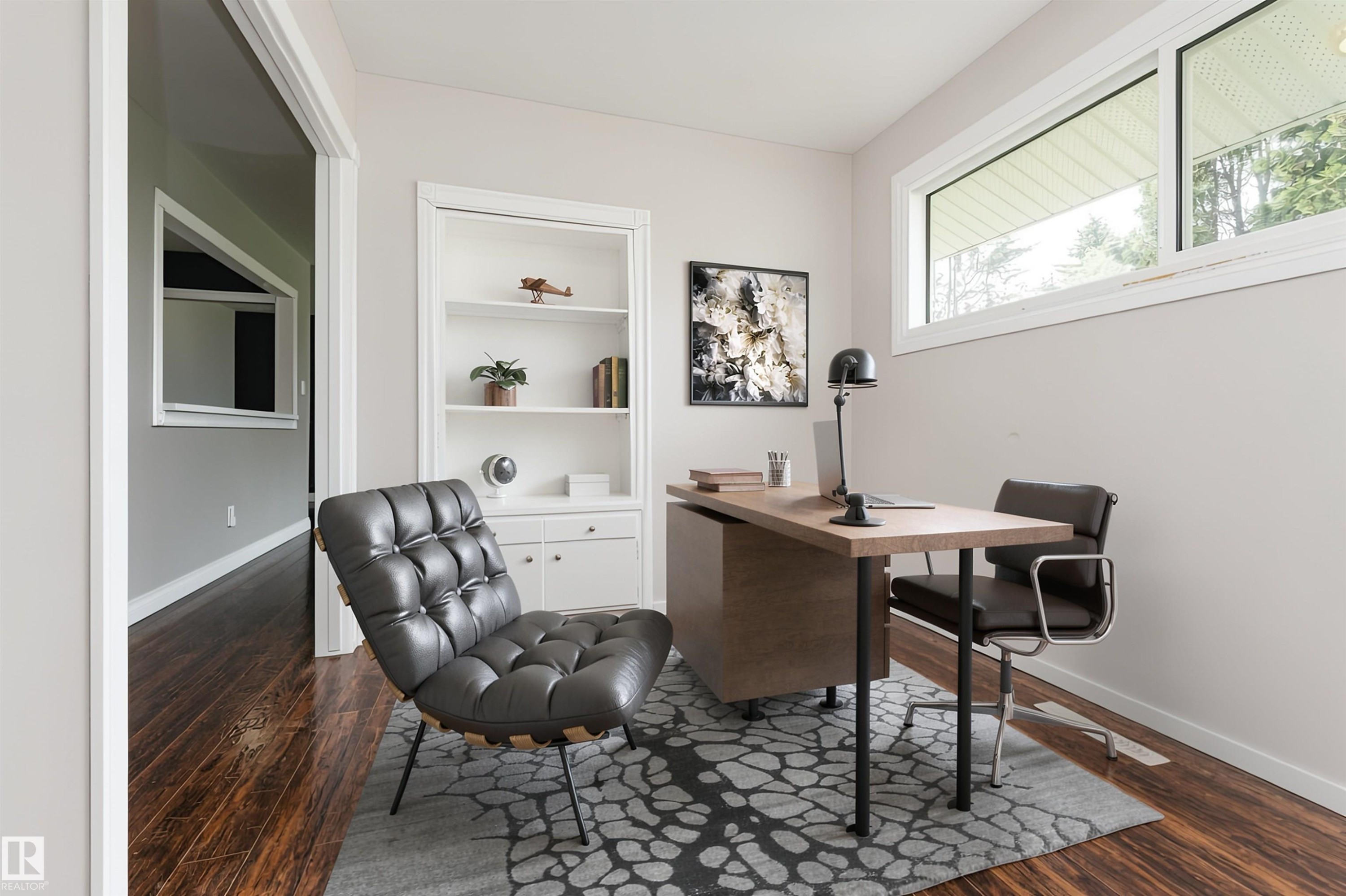 Dedicated office space featuring a built-in white bookshelf with lower cabinetry - 13411 140 Street, Edmonton, AB