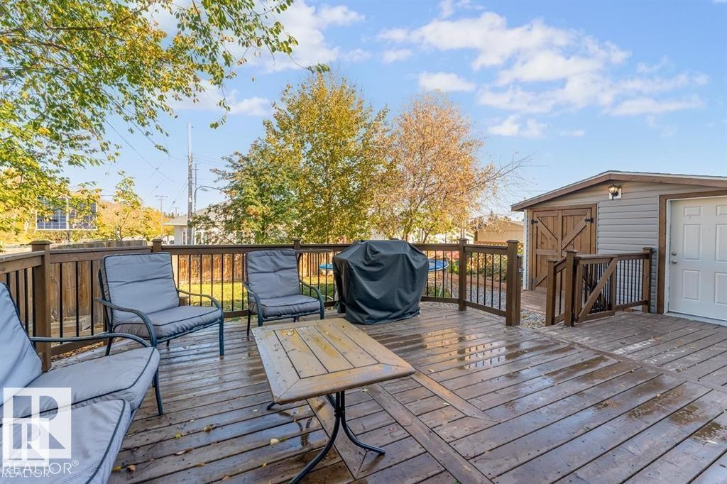 Spacious wood deck featuring railings, a privacy fence, and a multi-level design - 1112 13 Avenue, Cold Lake, AB - Outdoor With Deck Patio Veranda With Exterior