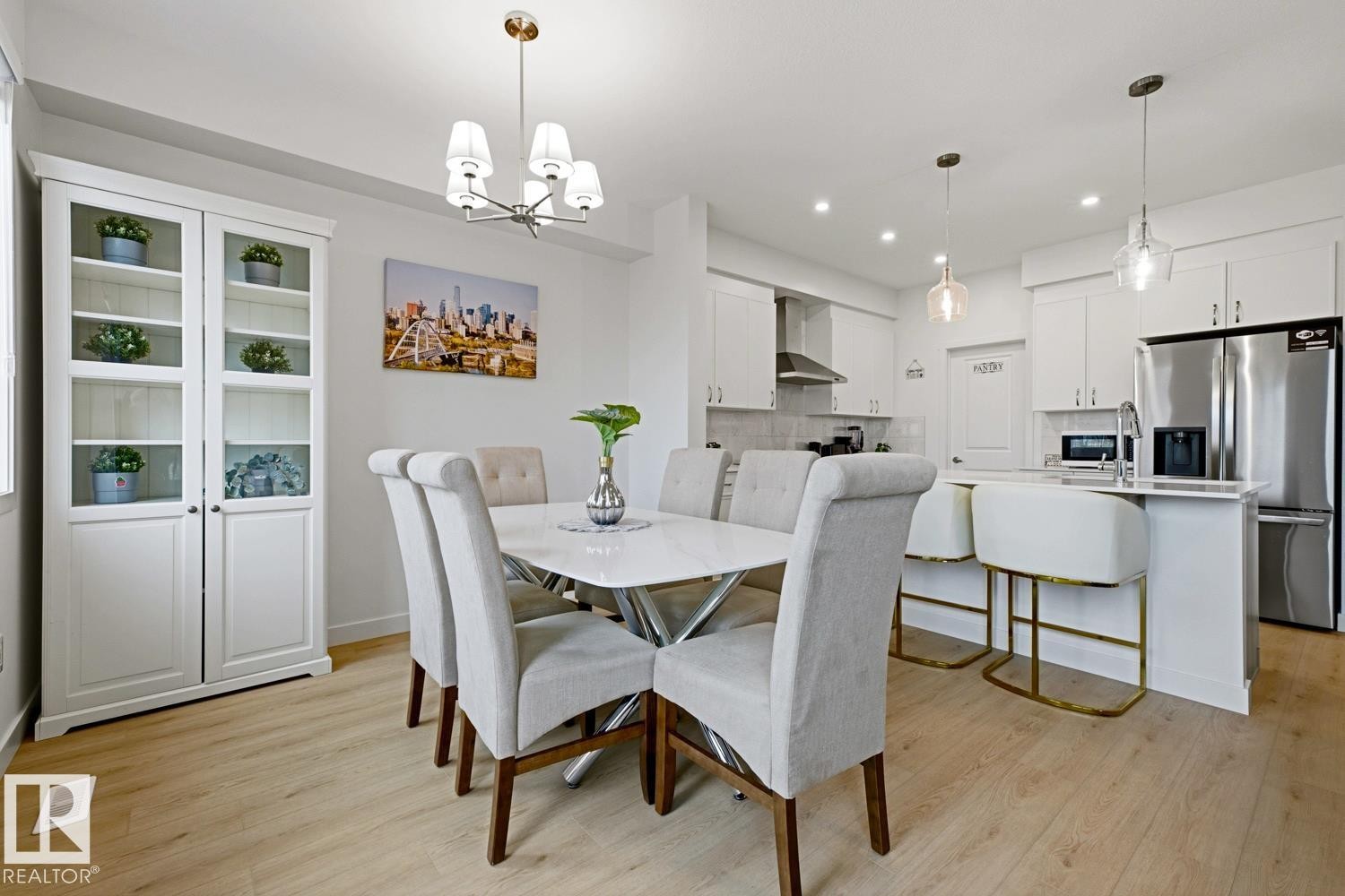 Open-concept dining area featuring light wood-finish flooring - 22924 82 Ave Nw, Edmonton, AB - Indoor Photo Showing Dining Room