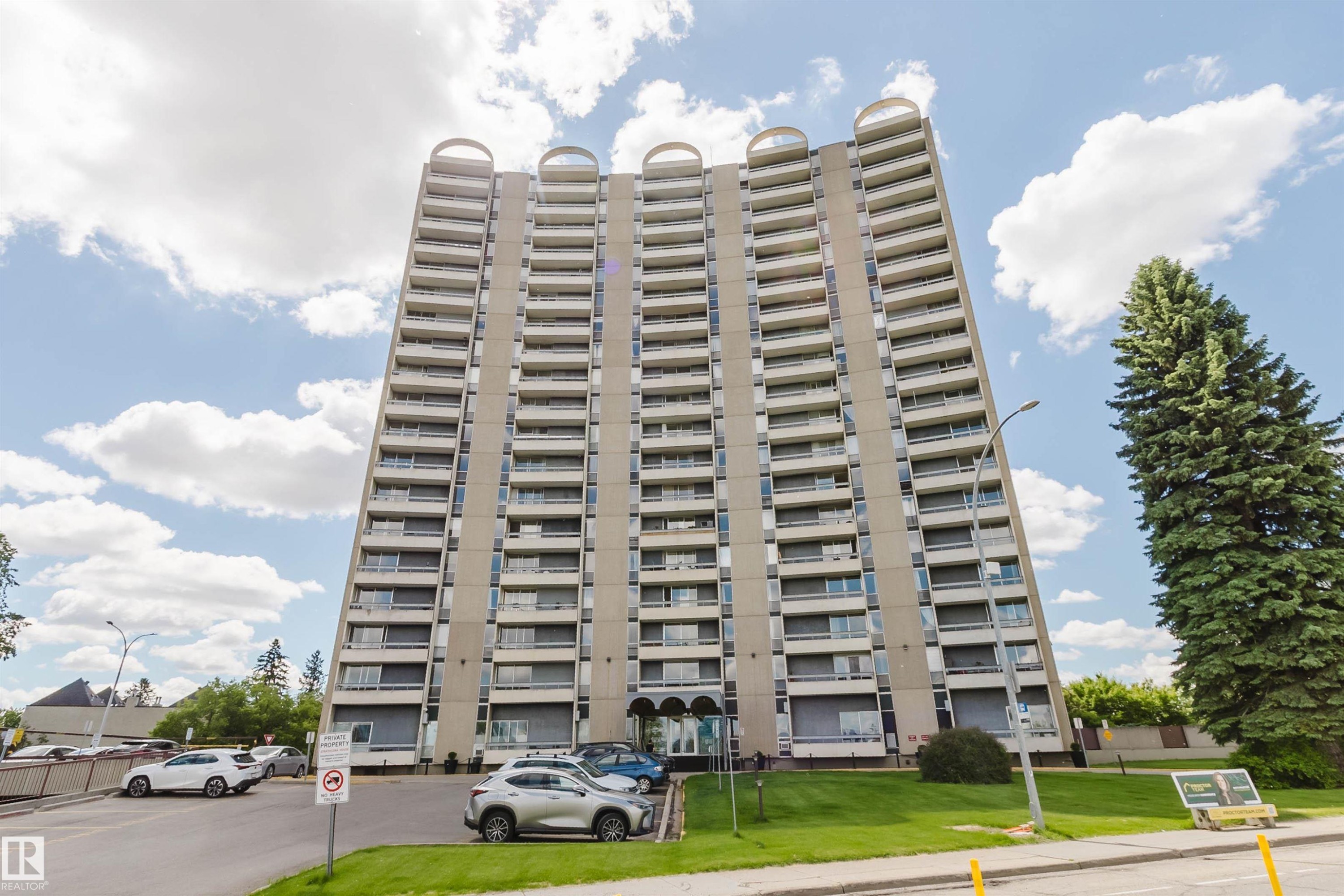 Multi-story residential building featuring a concrete facade and individual balconies - 904 10883 Saskatchewan Drive, Edmonton, AB