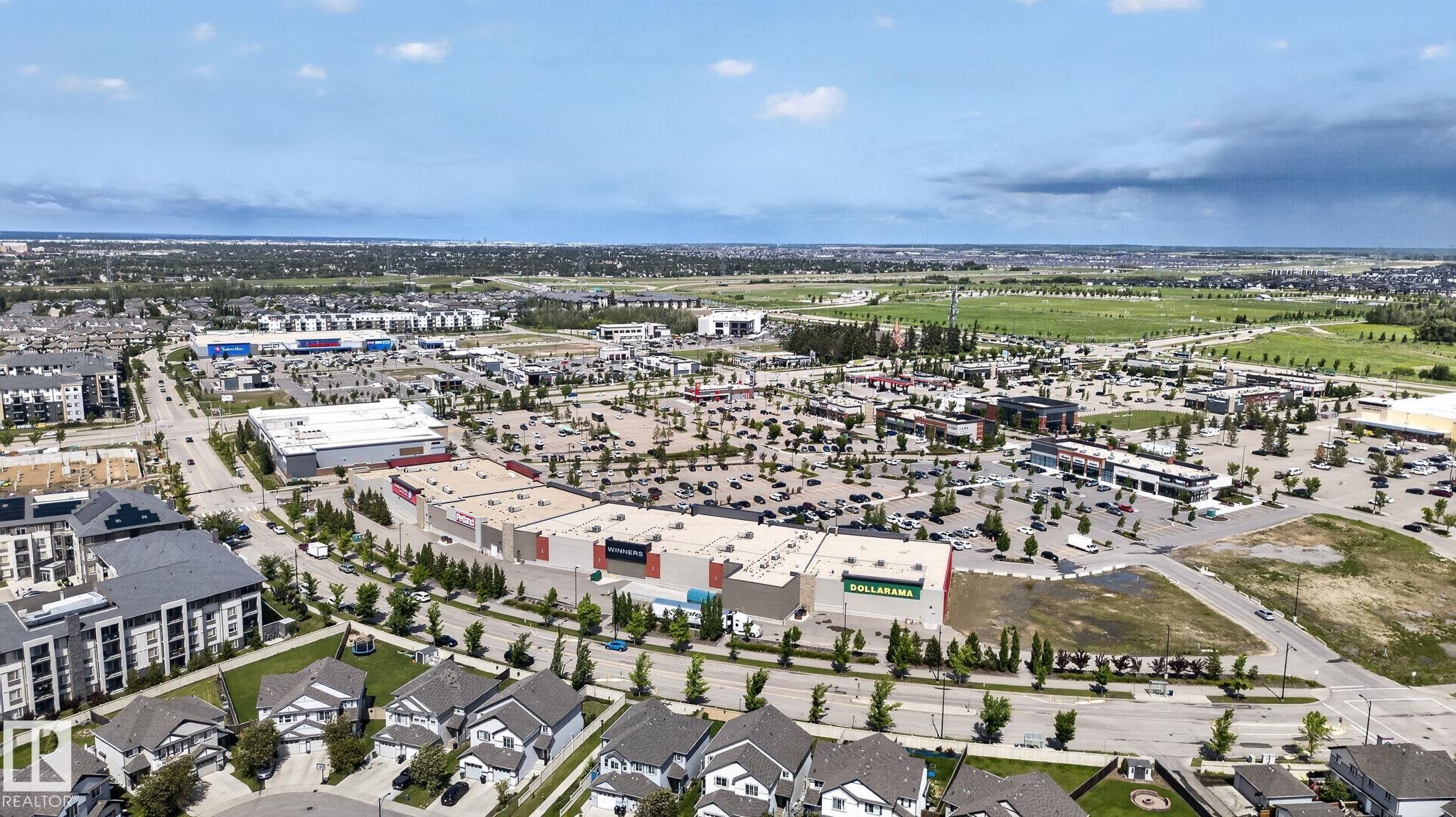 Aerial perspective showcasing commercial developments and residential properties - 545 Watt Boulevard Sw, Edmonton, AB - Outdoor With View