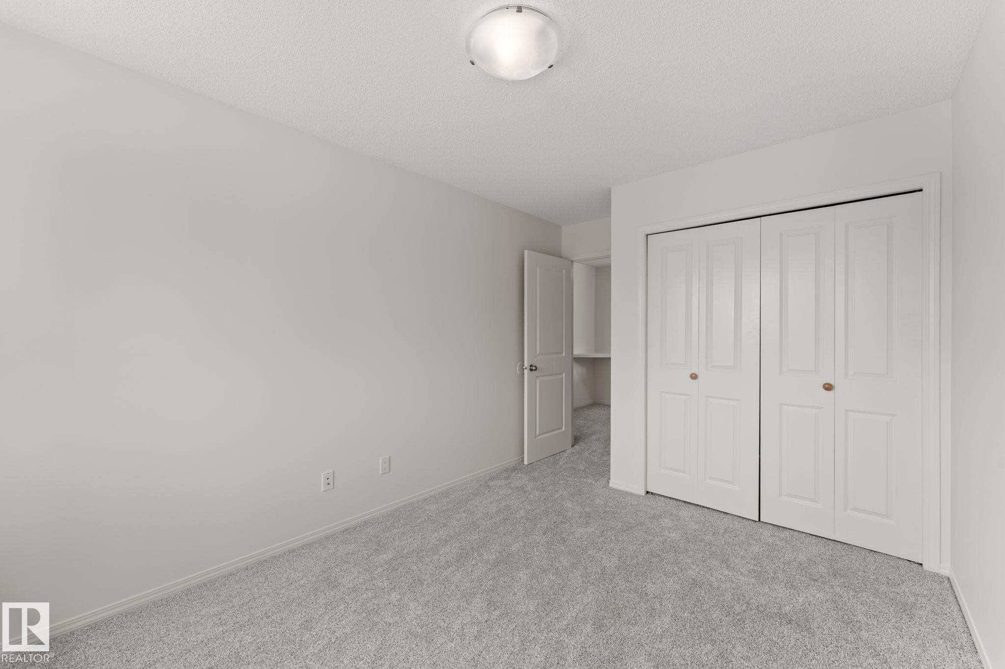 Room featuring light gray carpeting and white walls - 12523 171 Avenue, Edmonton, AB