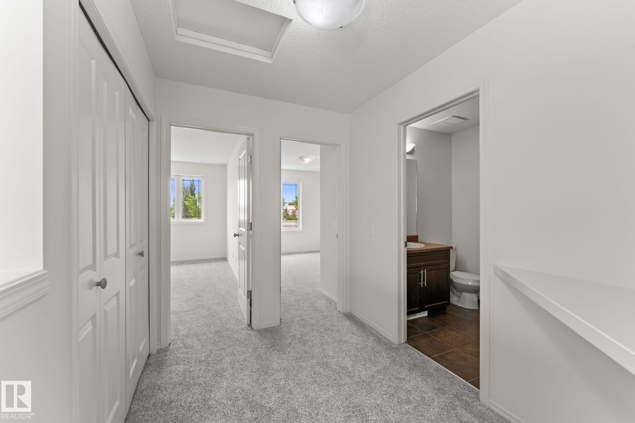 Upper-level hallway with light gray carpeting - 12523 171 Avenue, Edmonton, AB