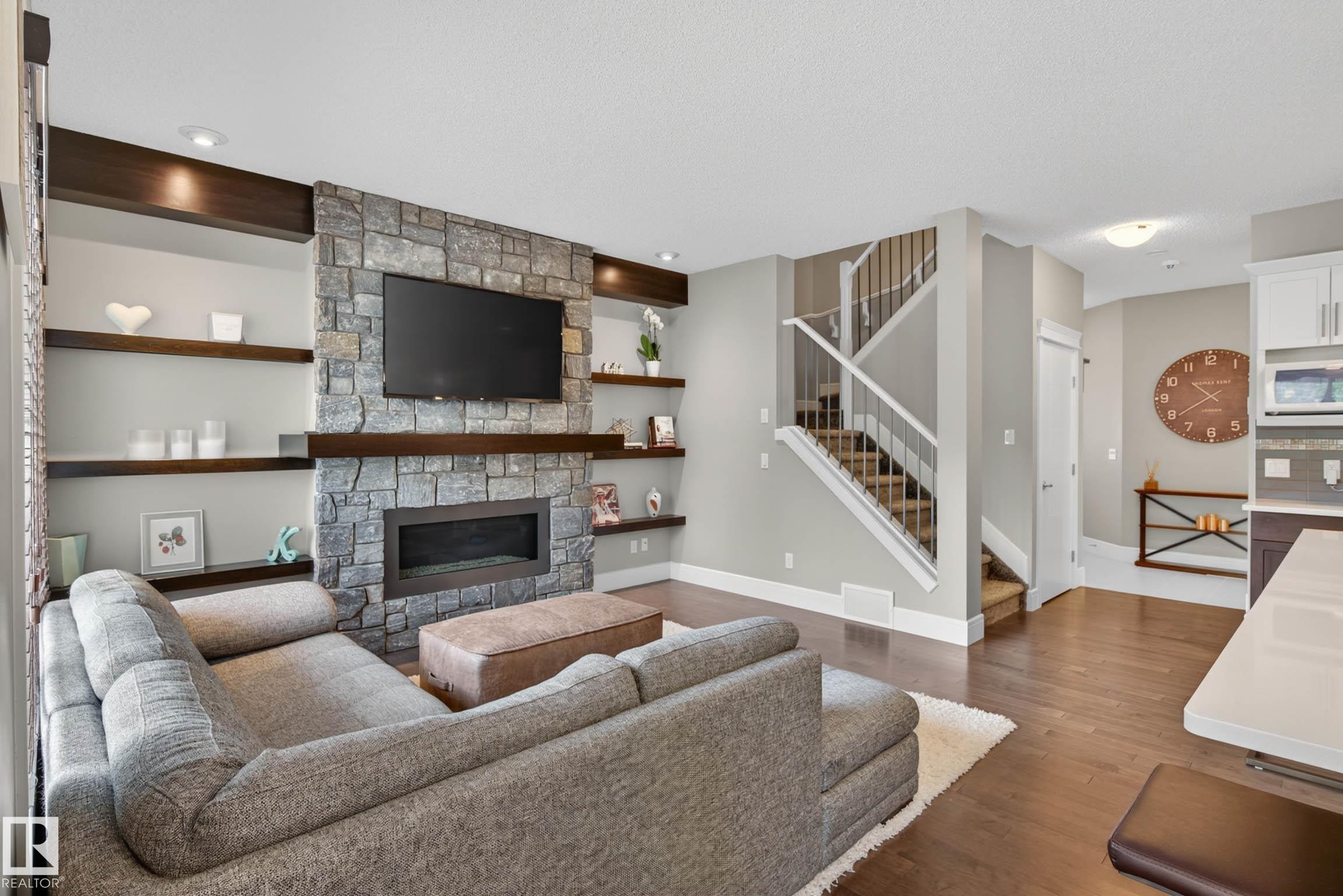 3411 Abbott Way, Edmonton, AB - Indoor Photo Showing Living Room With Fireplace