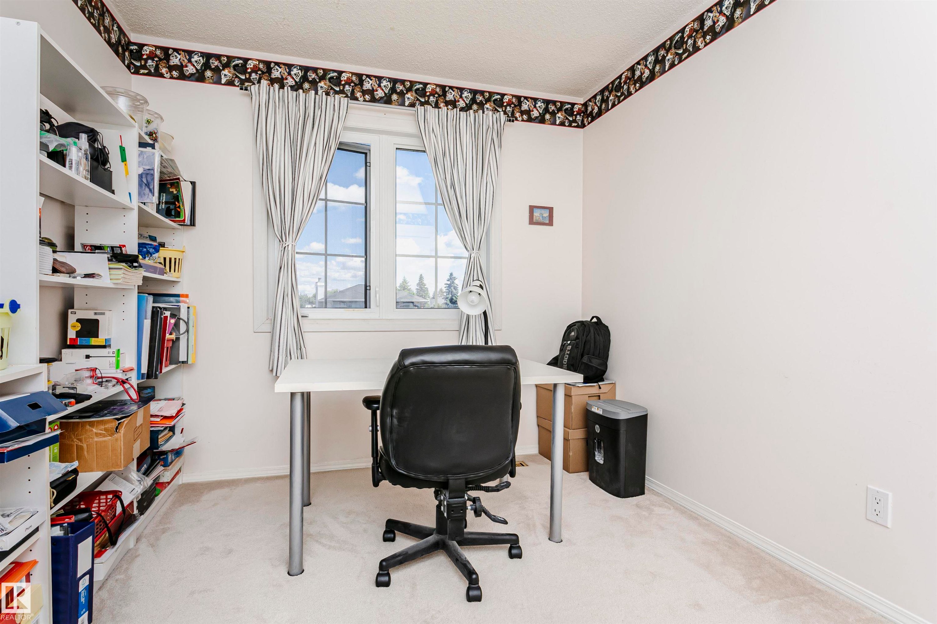 Room with light-toned carpeting, white walls, and a decorative border - 11023 11A Avenue Nw, Edmonton, AB - Indoor Photo Showing Office