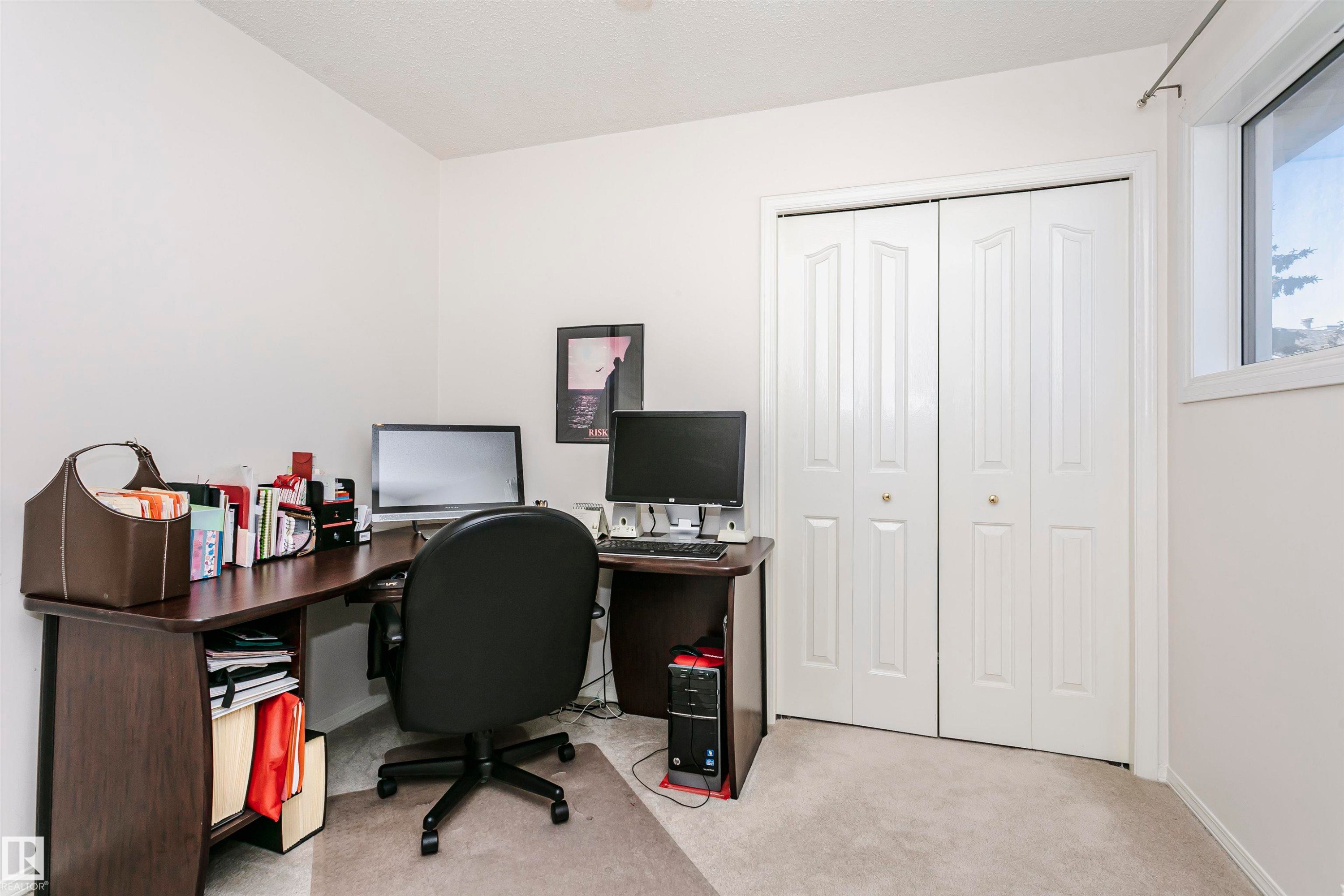 Room featuring light-colored wall paint and carpeted flooring - 11023 11A Avenue Nw, Edmonton, AB - Indoor Photo Showing Office