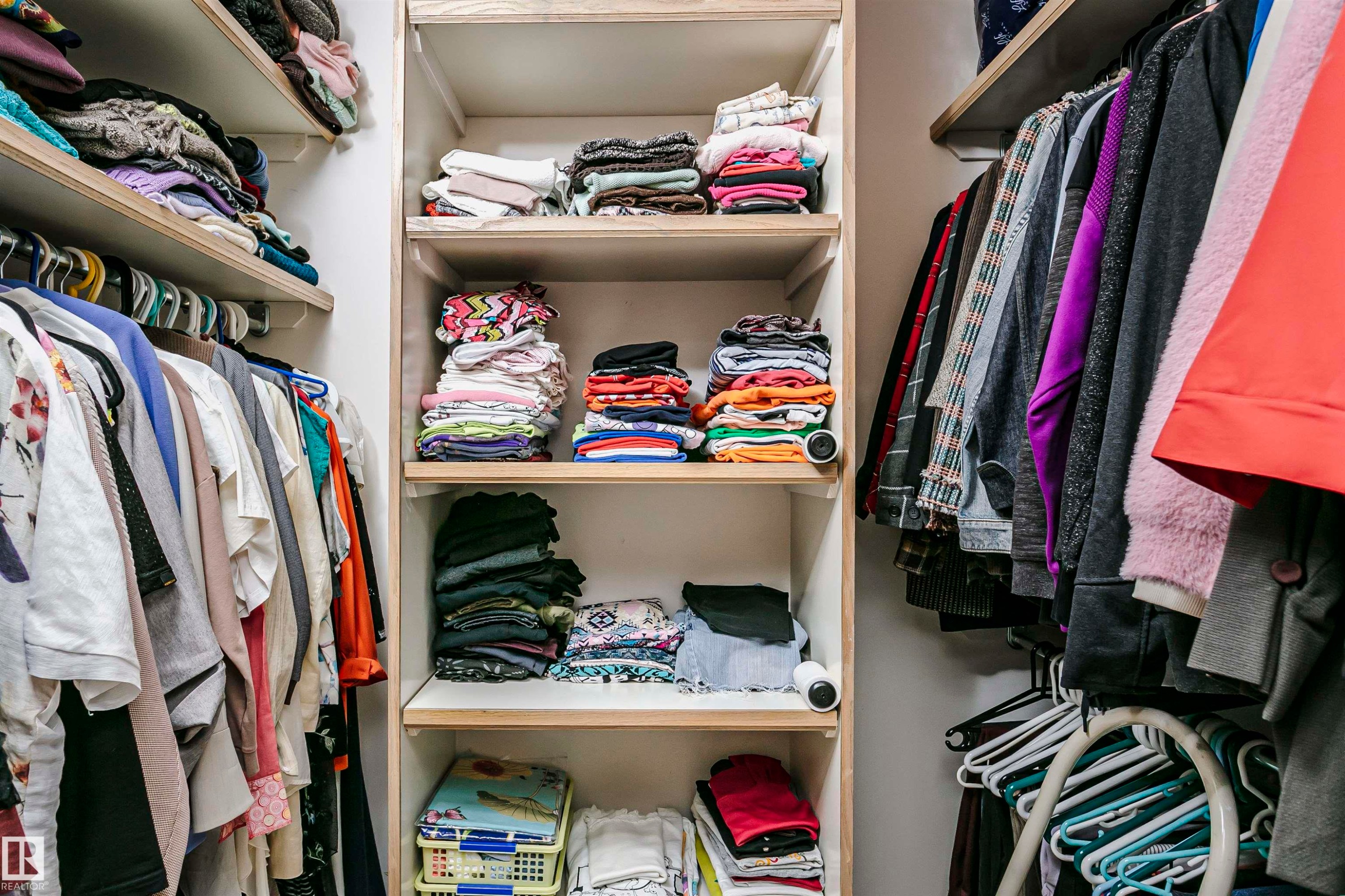 Built-in closet system featuring multiple shelves and hanging rods - 11023 11A Avenue Nw, Edmonton, AB - Indoor With Storage