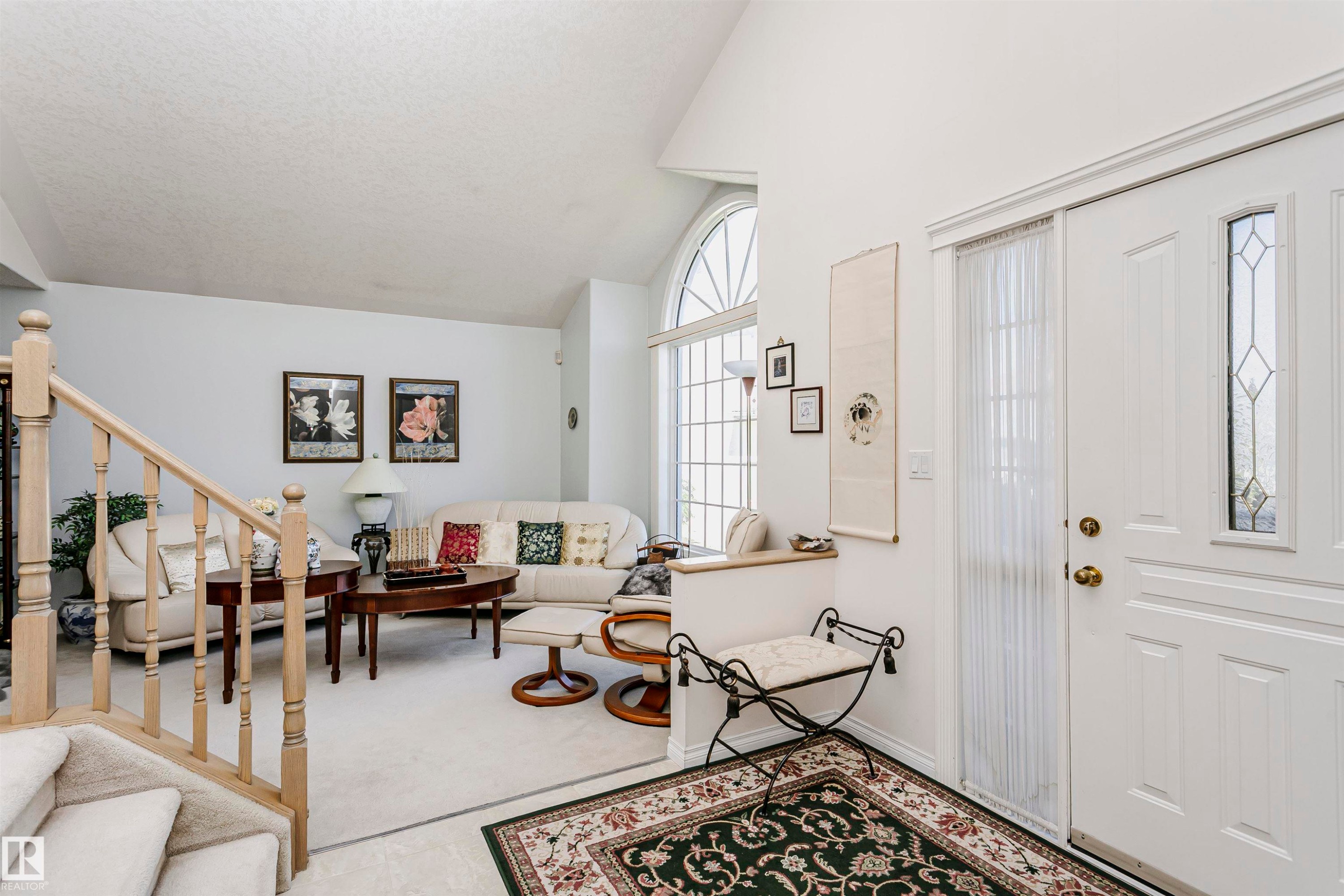 Entryway featuring a white paneled door with decorative glass inserts - 11023 11A Avenue Nw, Edmonton, AB - Indoor Photo Showing Other Room