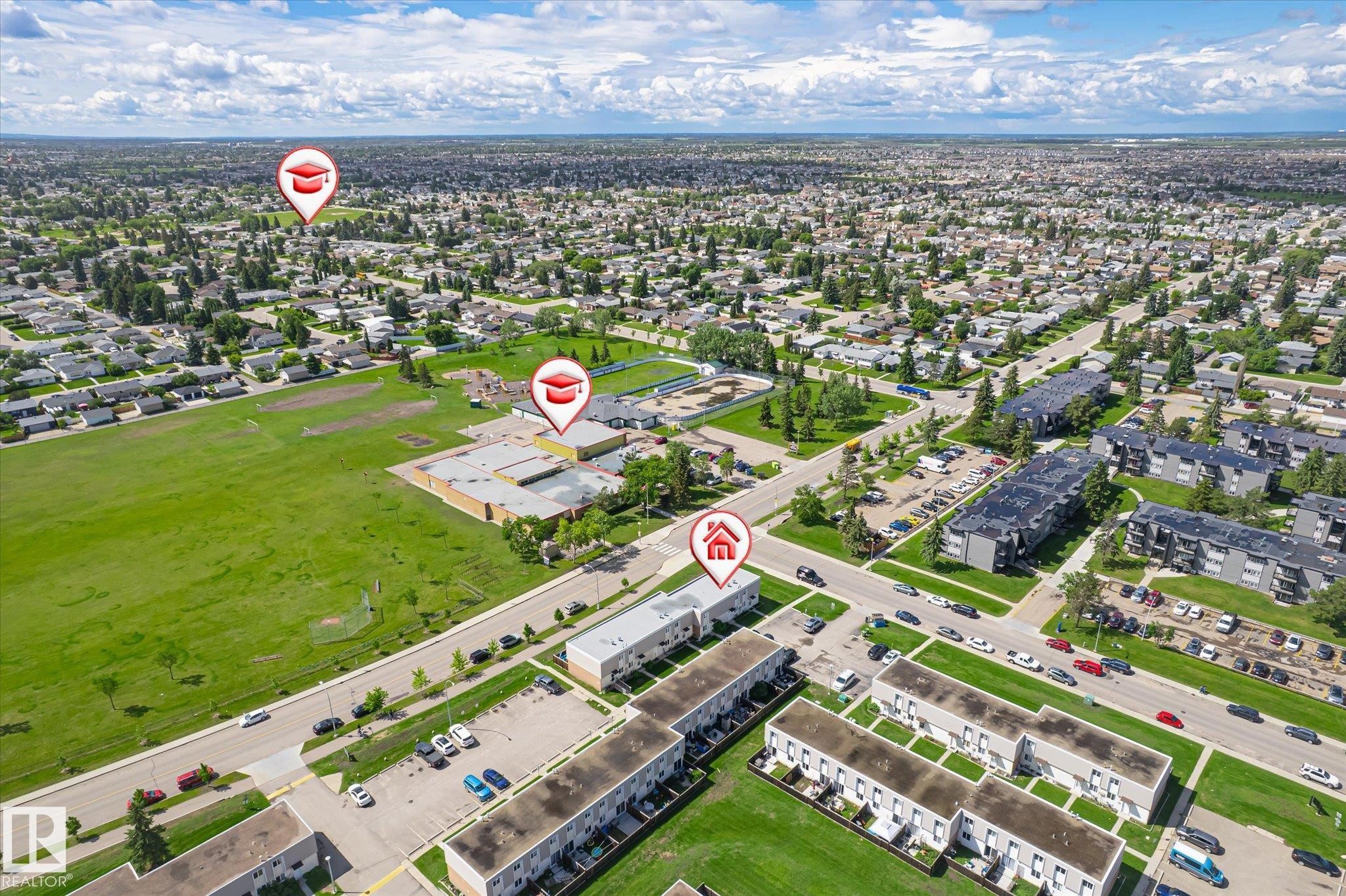 Aerial perspective of a dense residential neighborhood featuring a mix of detached homes and multi-story apartment buildings - 186 Cornell Crest, Edmonton, AB