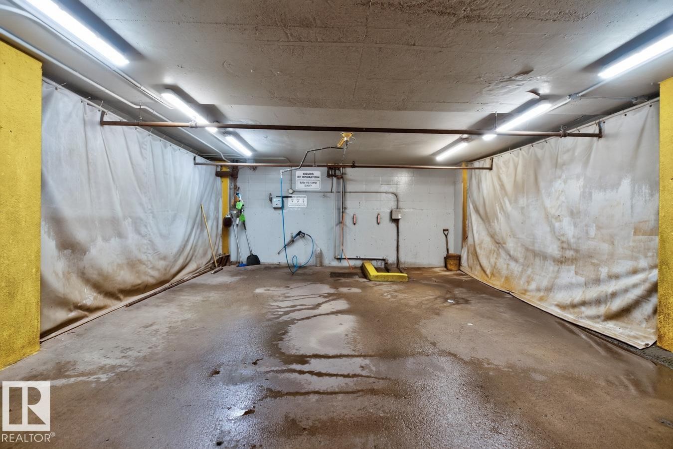 What if your car needs a good wash? No problem and no cost. - #602 12303 Jasper Av Nw, Edmonton, AB - Indoor Photo Showing Garage