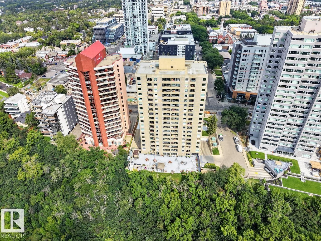 Concrete High-rise building with a ground-level patio, and surrounding urban landscape - #602 12303 Jasper Av Nw, Edmonton, AB - Outdoor