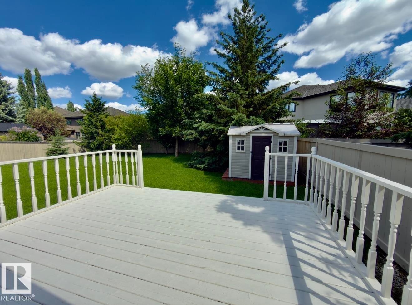 Spacious outdoor deck with white painted railings - 134 Wolf Ridge Place, Edmonton, AB