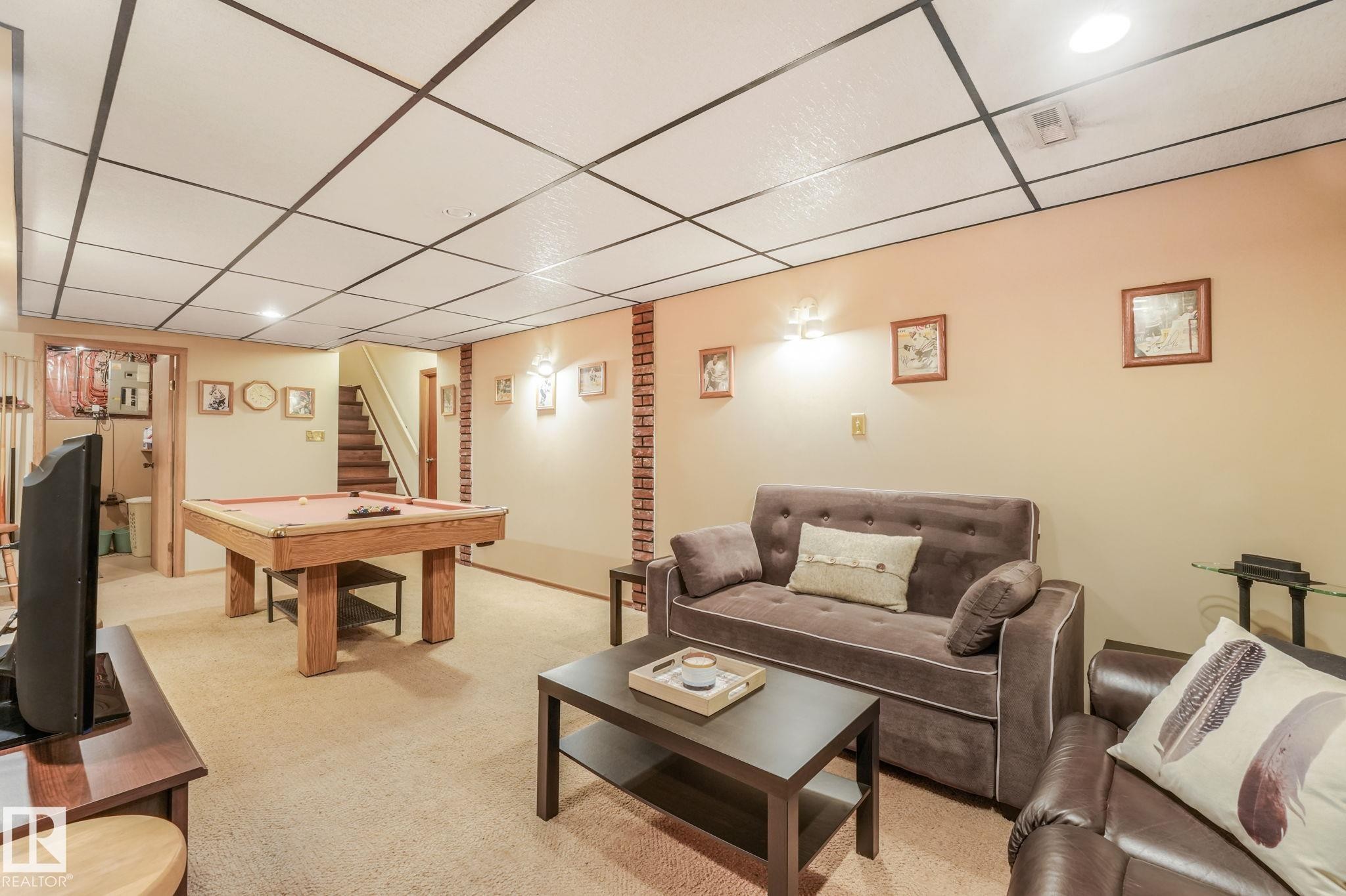Finished recreational space featuring recessed lighting, a drop ceiling, and carpeted flooring - 17237 104 Street, Edmonton, AB