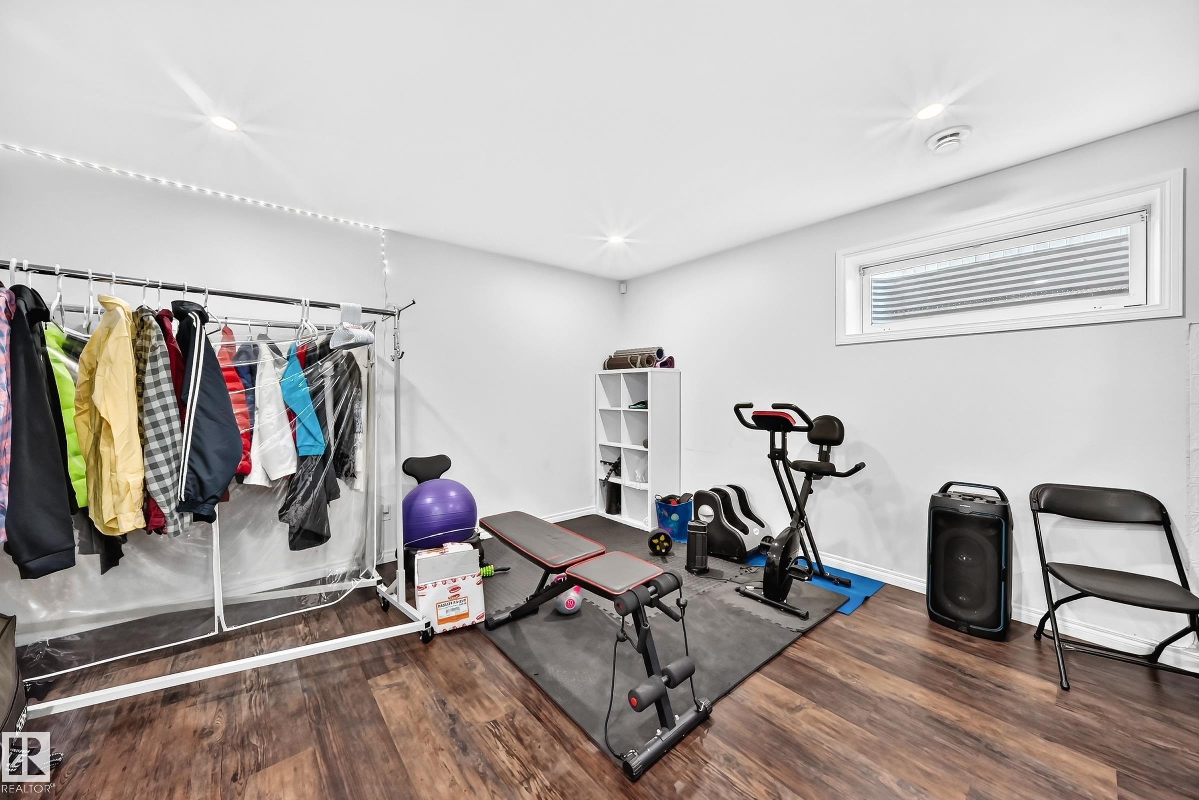Versatile room featuring wood-finish flooring and recessed lighting - 12410 171A Avenue, Edmonton, AB
