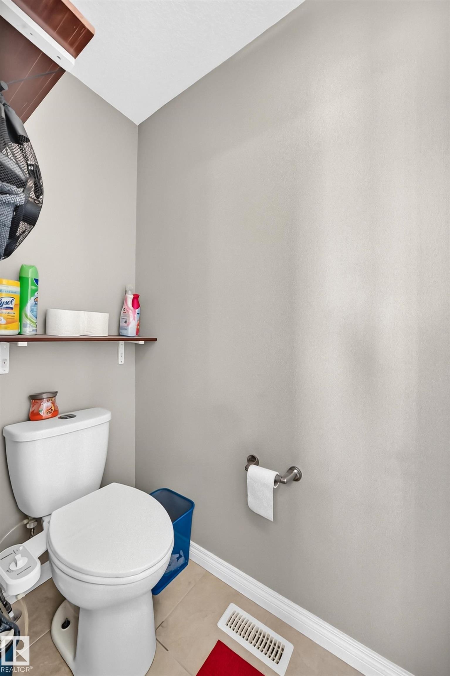 White ceramic toilet with a round bowl and tank - 12410 171A Avenue, Edmonton, AB