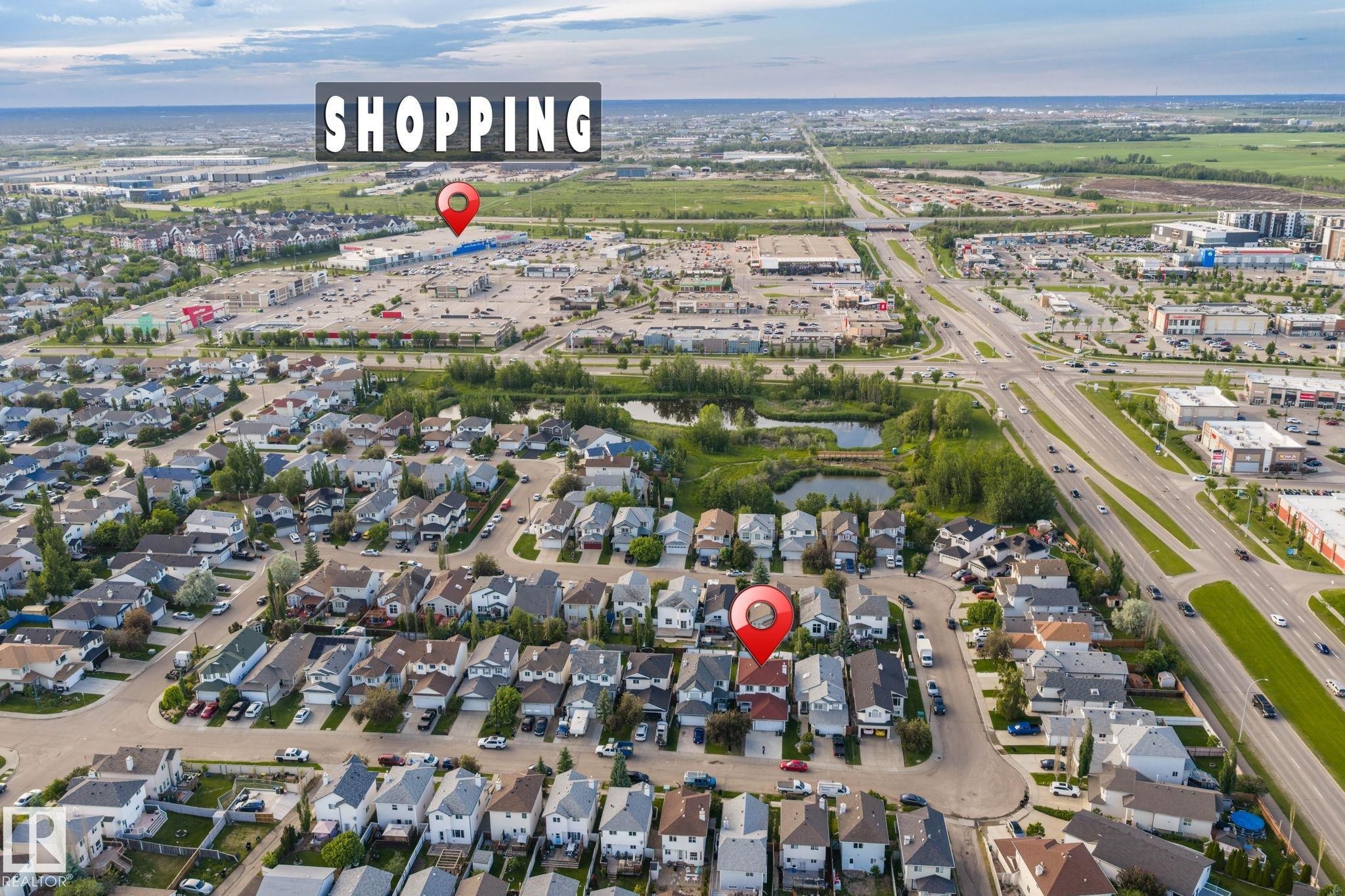 Aerial perspective showcasing a residential neighborhood with varied housing styles - 1906 37B Av Nw, Edmonton, AB - Outdoor With View