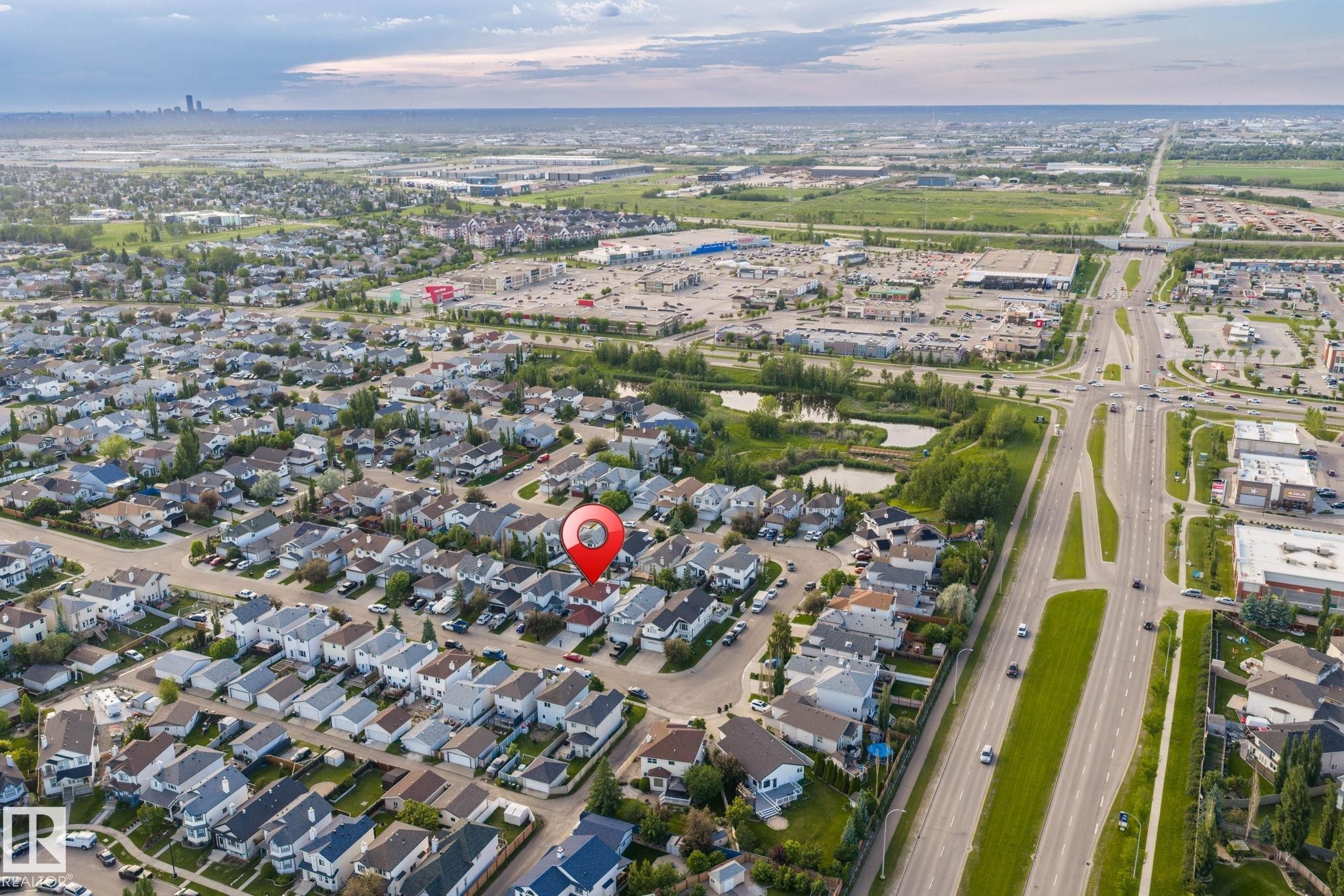 Aerial perspective showcasing a residential neighborhood with varied housing styles - 1906 37B Av Nw, Edmonton, AB - Outdoor With View