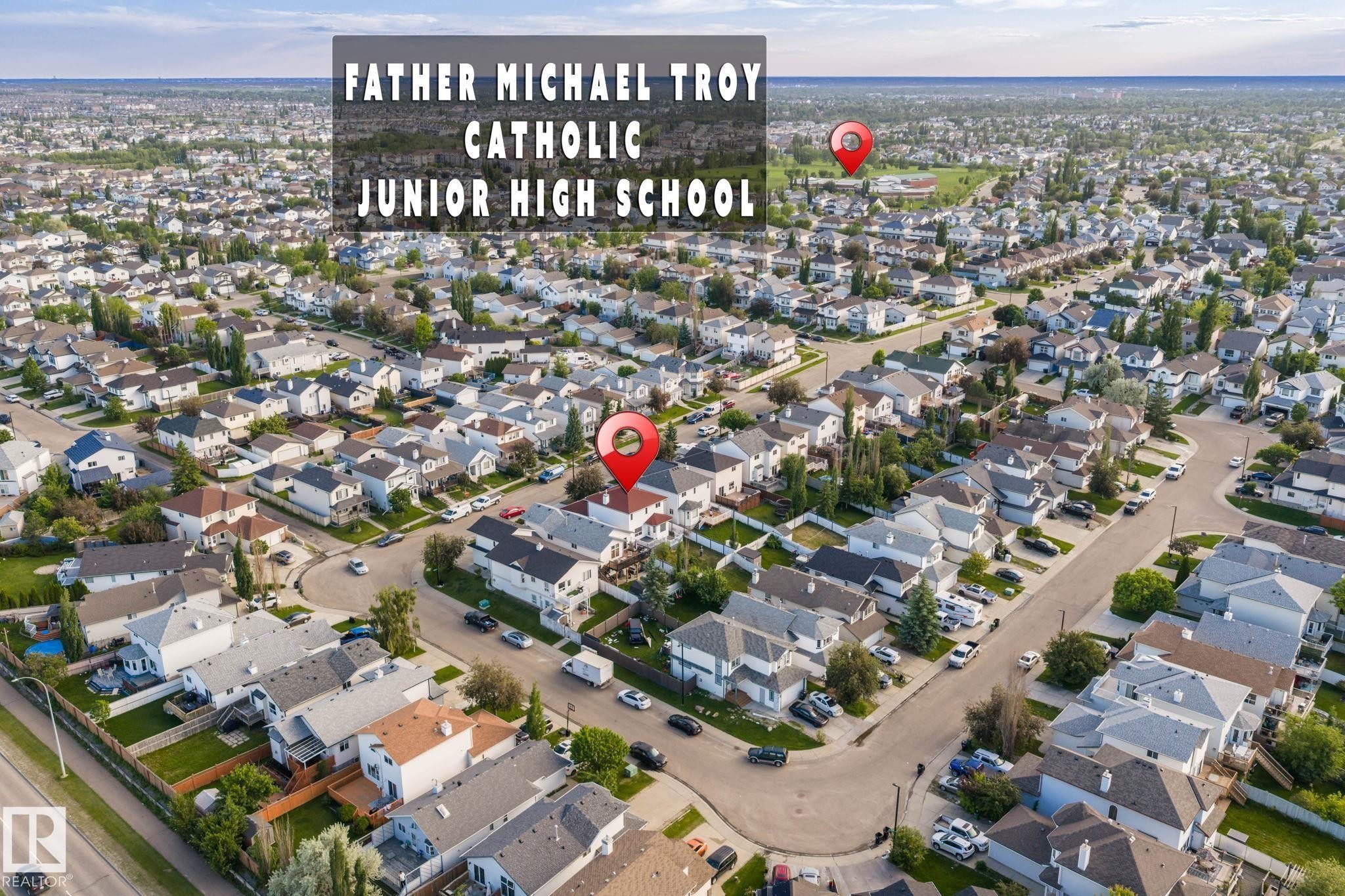 Residential neighborhood featuring multiple single-family homes with various rooflines and exterior finishes - 1906 37B Av Nw, Edmonton, AB - Outdoor With View
