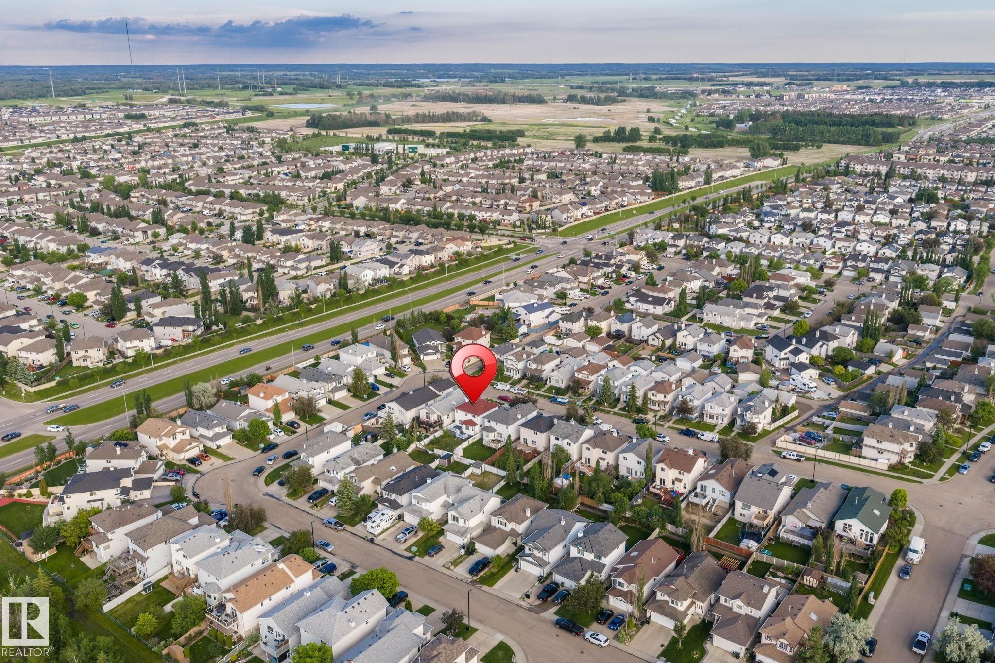 Aerial perspective highlighting a suburban neighborhood characterized by uniform residential structures - 1906 37B Av Nw, Edmonton, AB - Outdoor With View