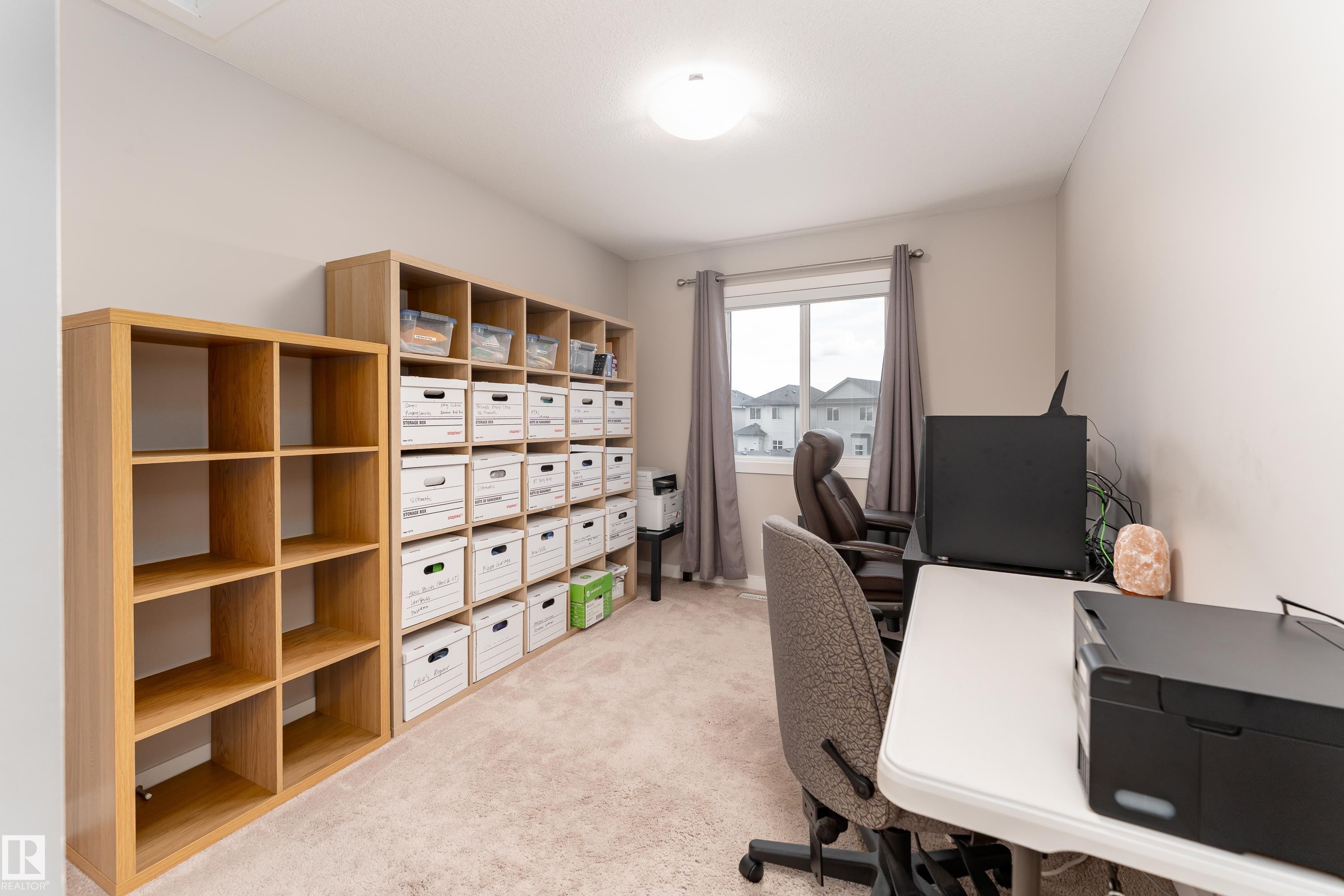 Carpeted room with a ceiling-mounted light fixture - 191 Reed Place, Leduc, AB - Indoor Photo Showing Office