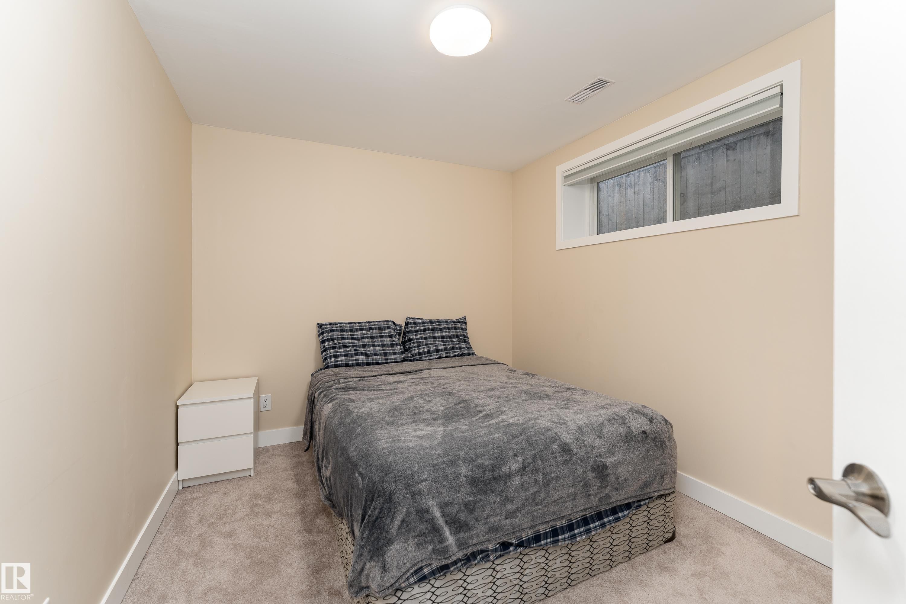 Compact room featuring neutral-toned walls and plush carpeting - 191 Reed Place, Leduc, AB - Indoor Photo Showing Bedroom