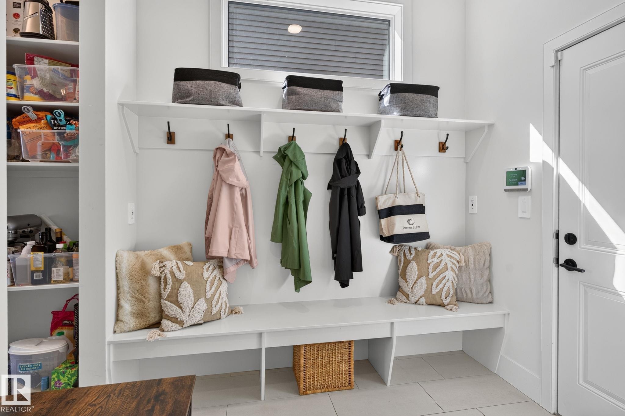 Mudroom with built-in bench seating, upper shelving, and coat hooks - 14 Jane Point(E), St. Albert, AB