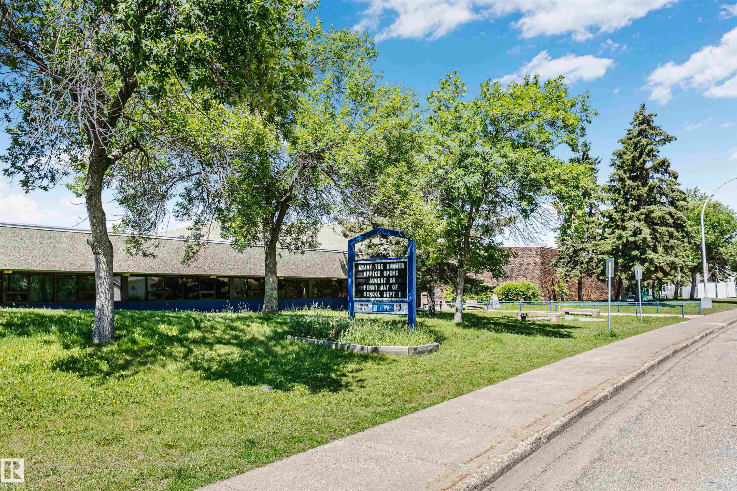 Commercial building with a low-slope roof and expansive window line - 1612 80A Street, Edmonton, AB
