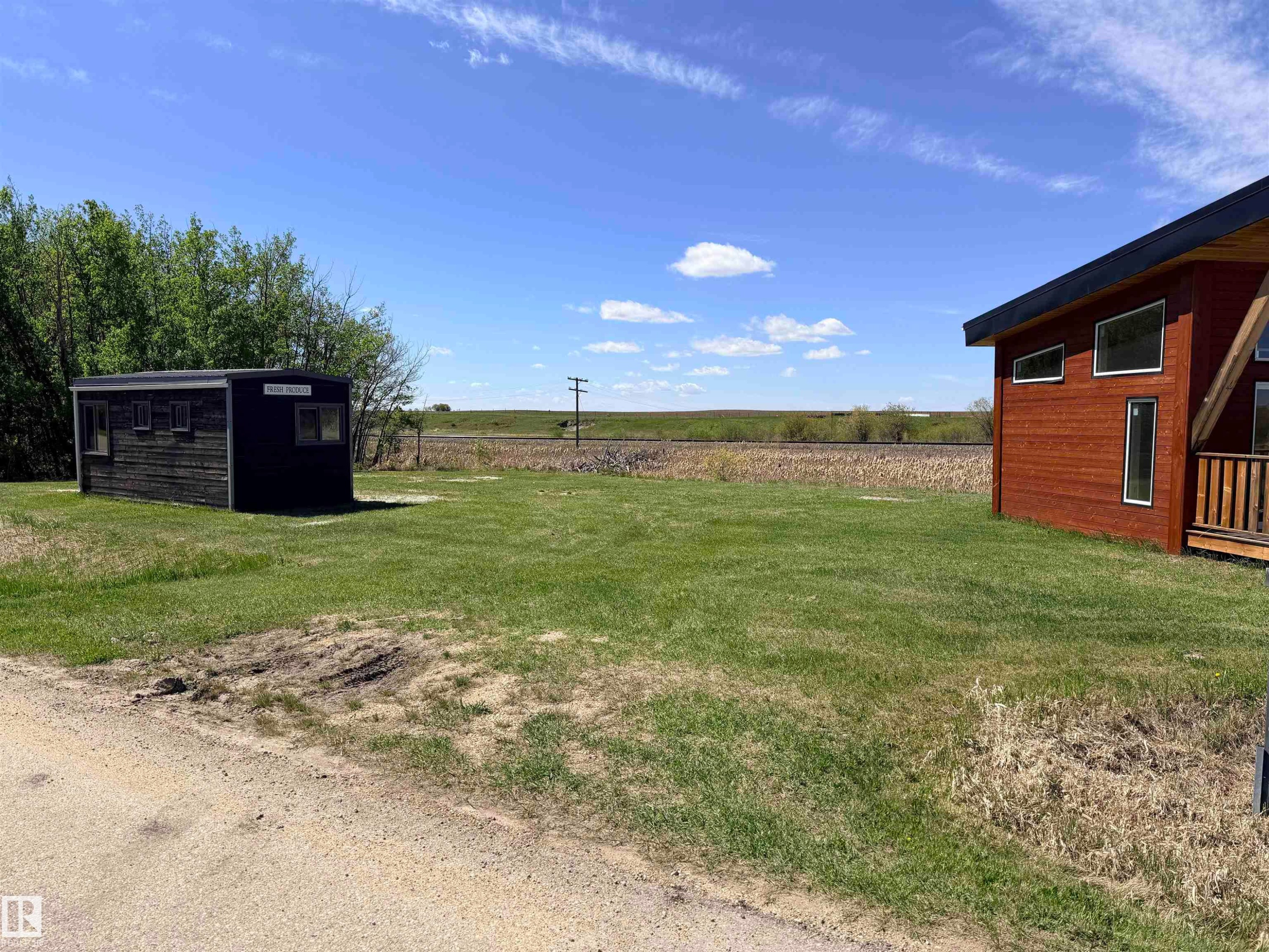 Expansive grassy lot featuring two distinct structures - 50 Ave. 52 St., Rural Westlock County, AB
